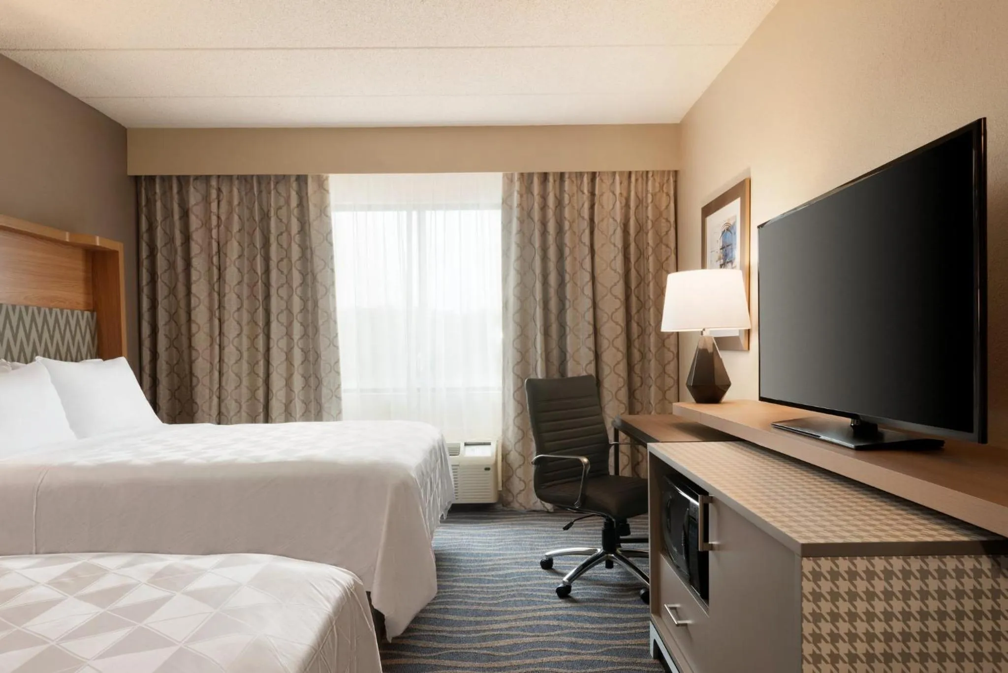 Photo of the whole room, Bed in Holiday Inn Hotel & Suites Council Bluffs by IHG