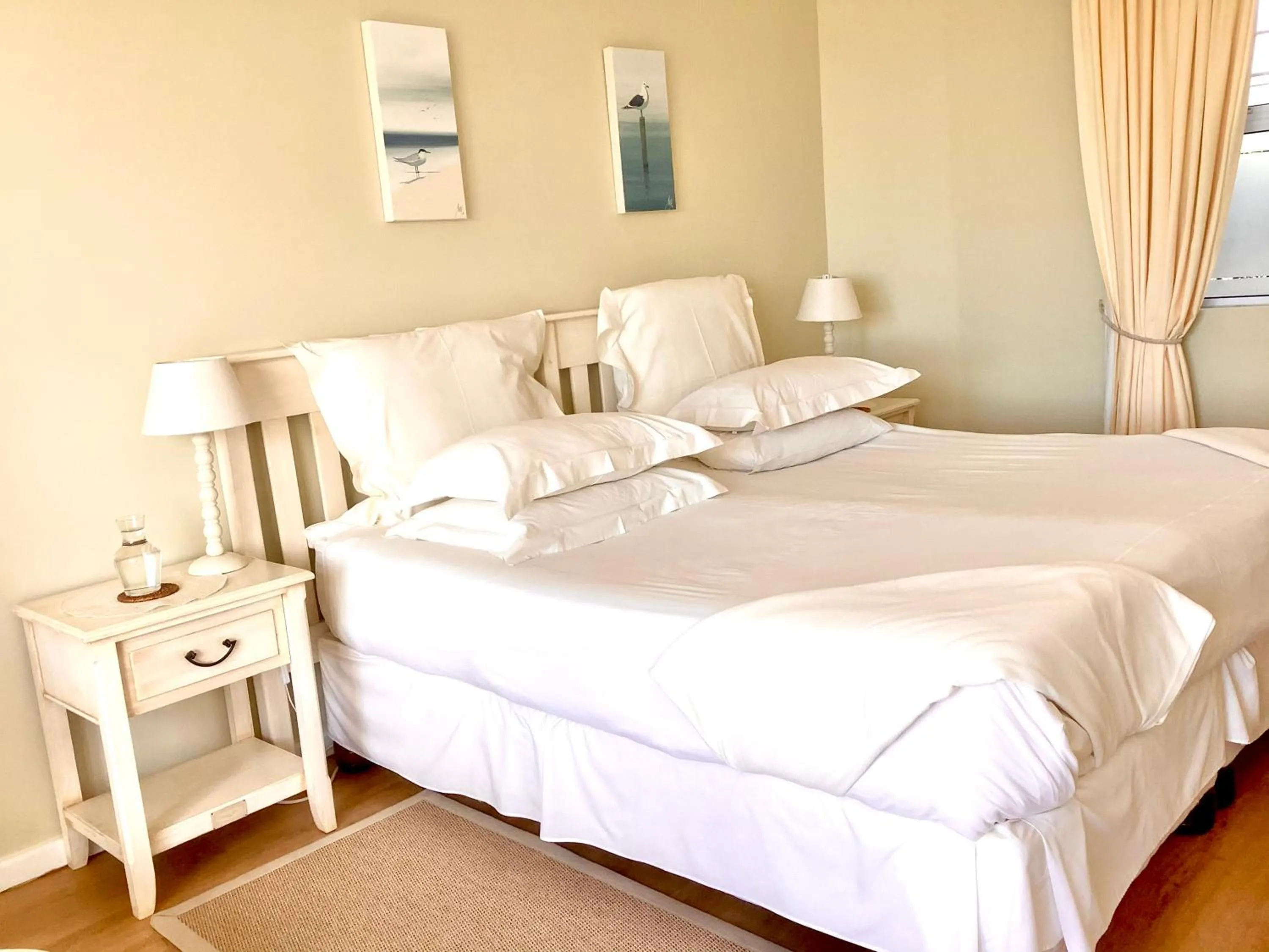 Bed in Dolphins' Playground Beachfront B&B