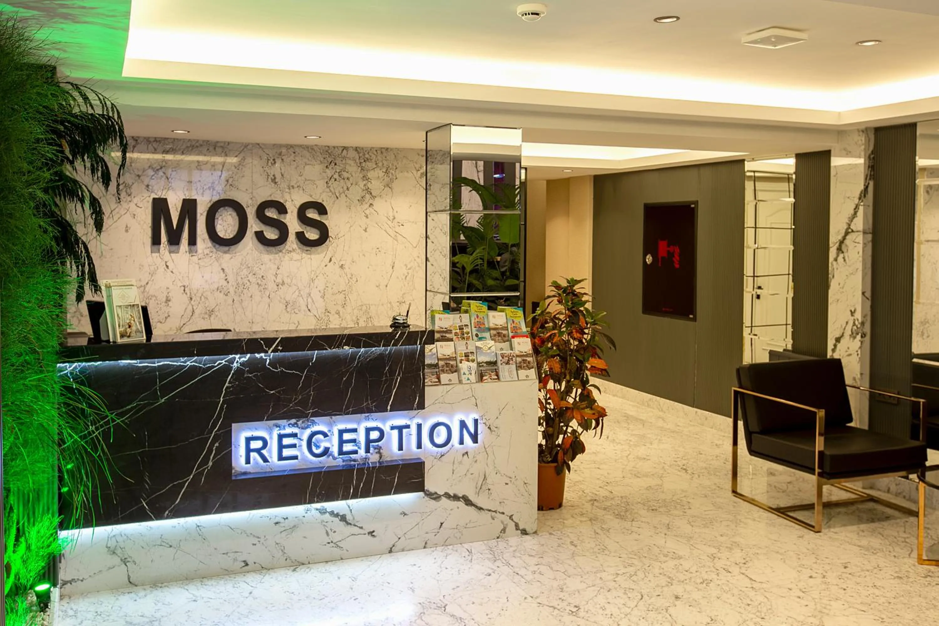 Lobby or reception in Moss Suites Hotel