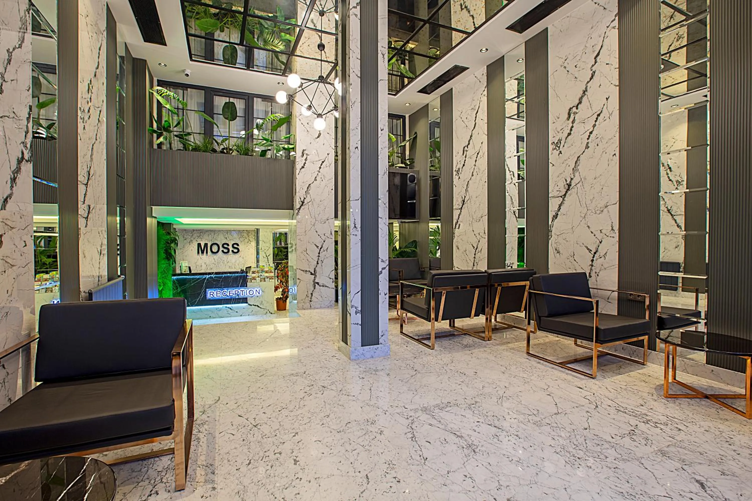 Lobby or reception in Moss Suites Hotel