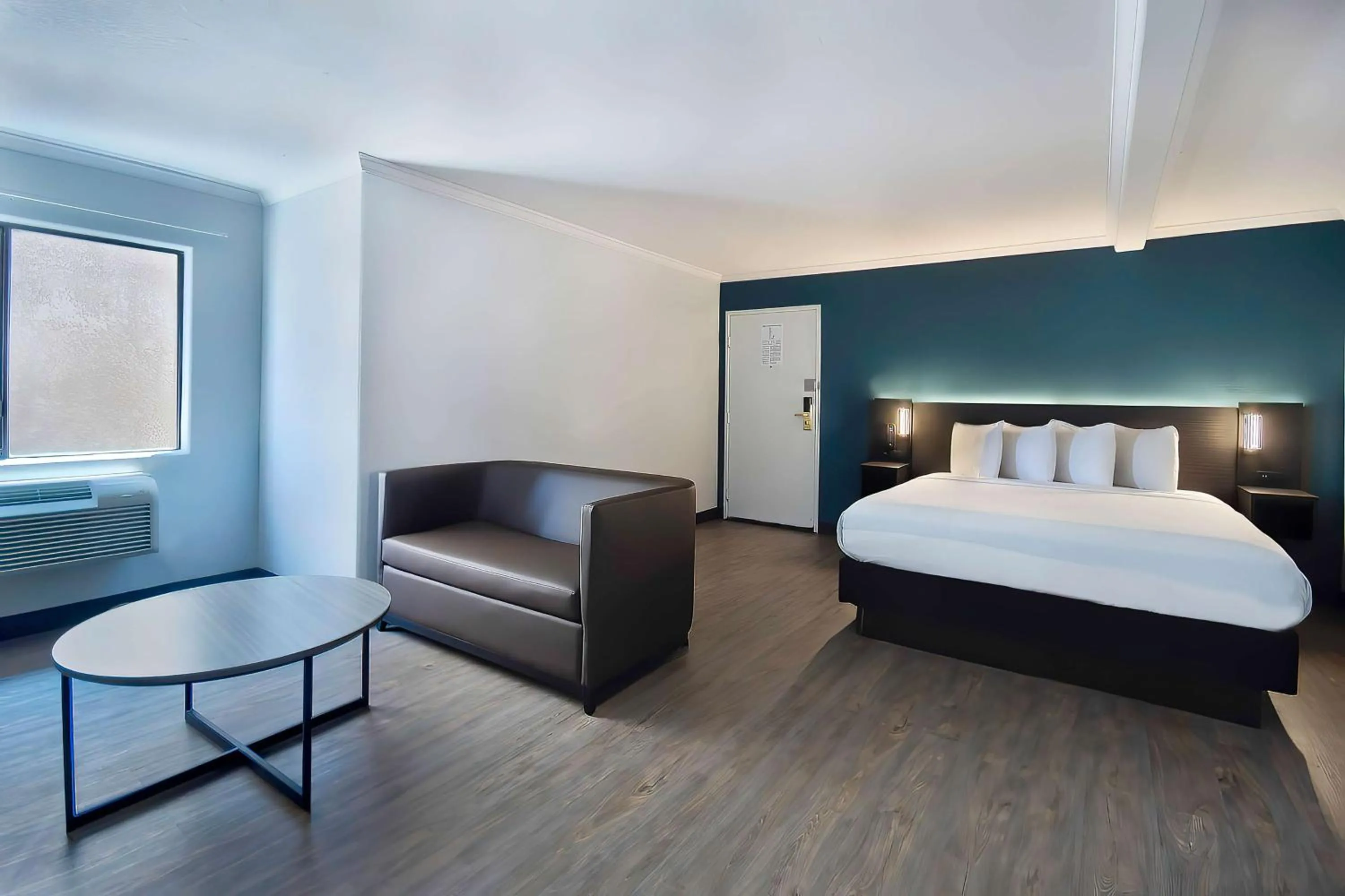 Seating area, Bed in Studio 6 Suites Lawndale, CA South Bay