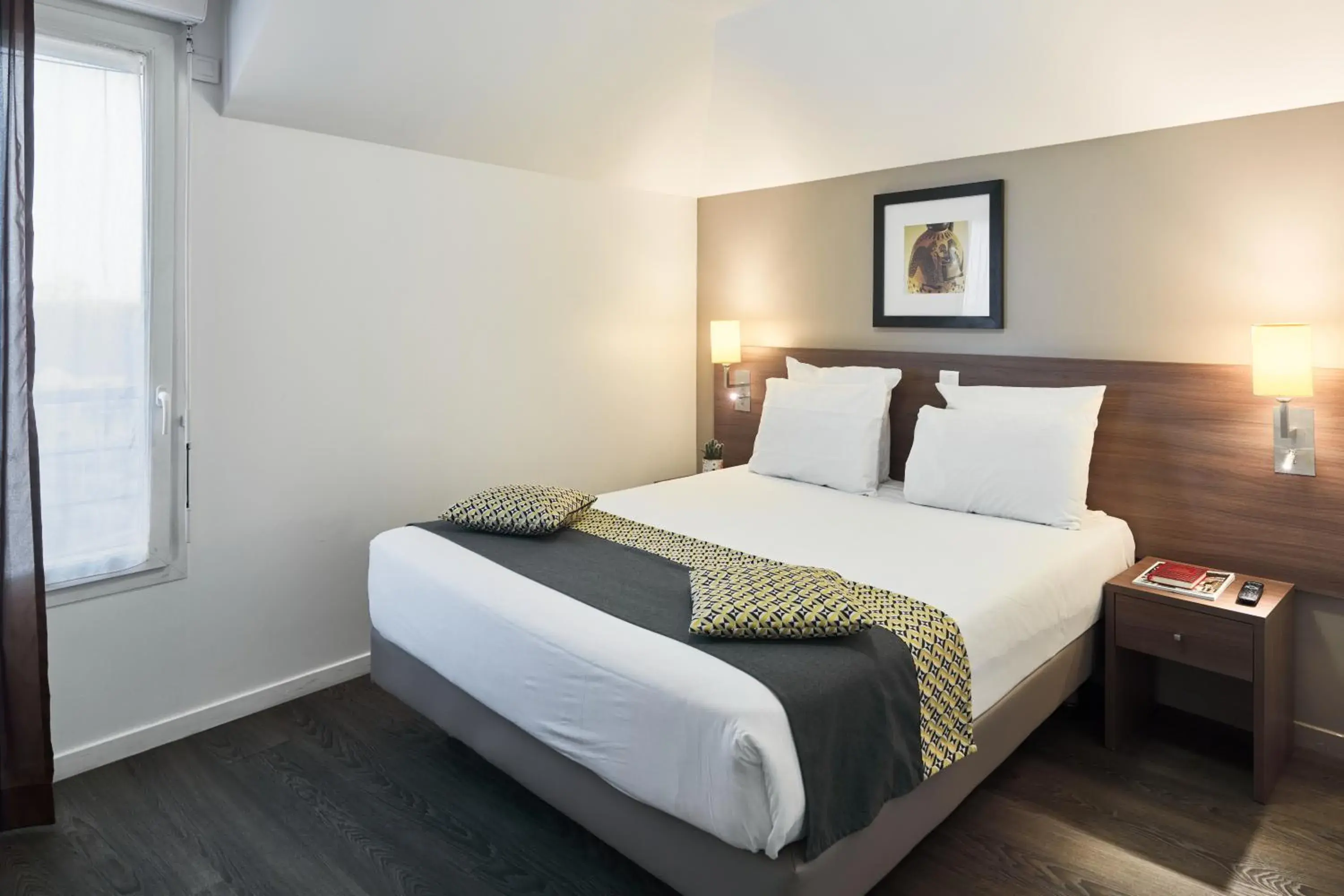 Bed in Zenitude Hôtel Résidences Roissy Village Bed in Zenitude Hôtel Résidences Roissy Village