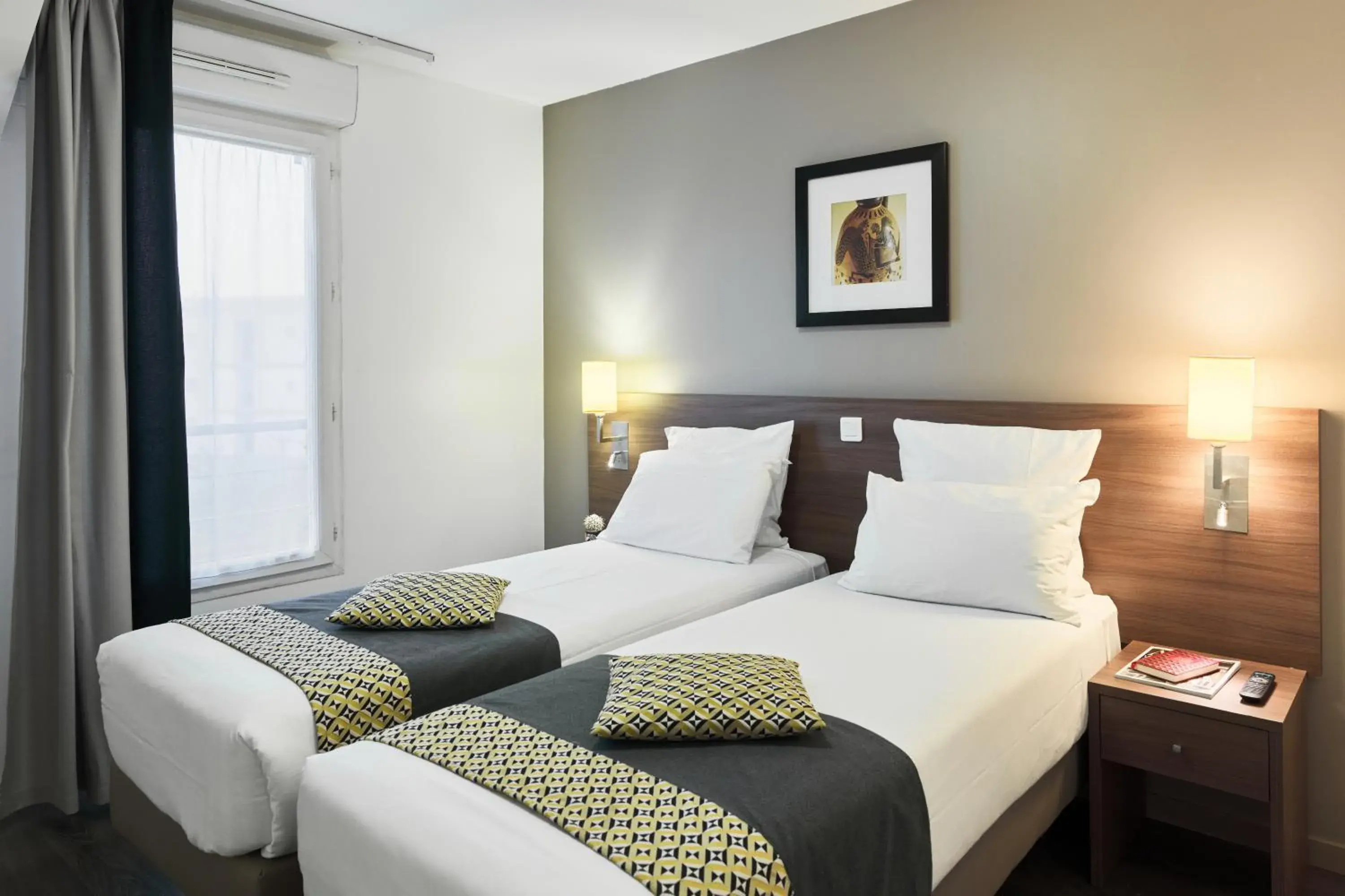 Bed in Zenitude Hôtel Résidences Roissy Village Bed in Zenitude Hôtel Résidences Roissy Village