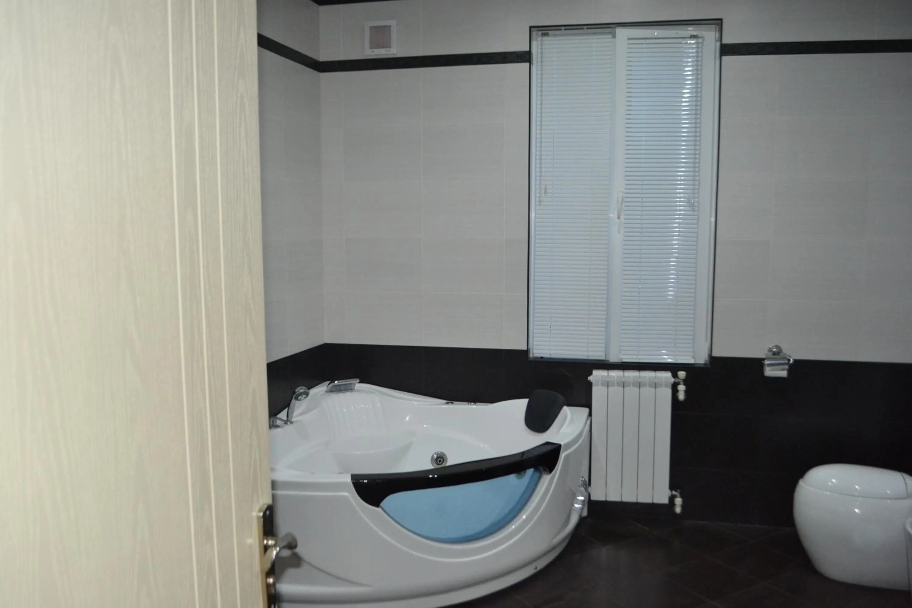 Bathroom, Bed in Tskaltubo Apartment Mirian Mepe