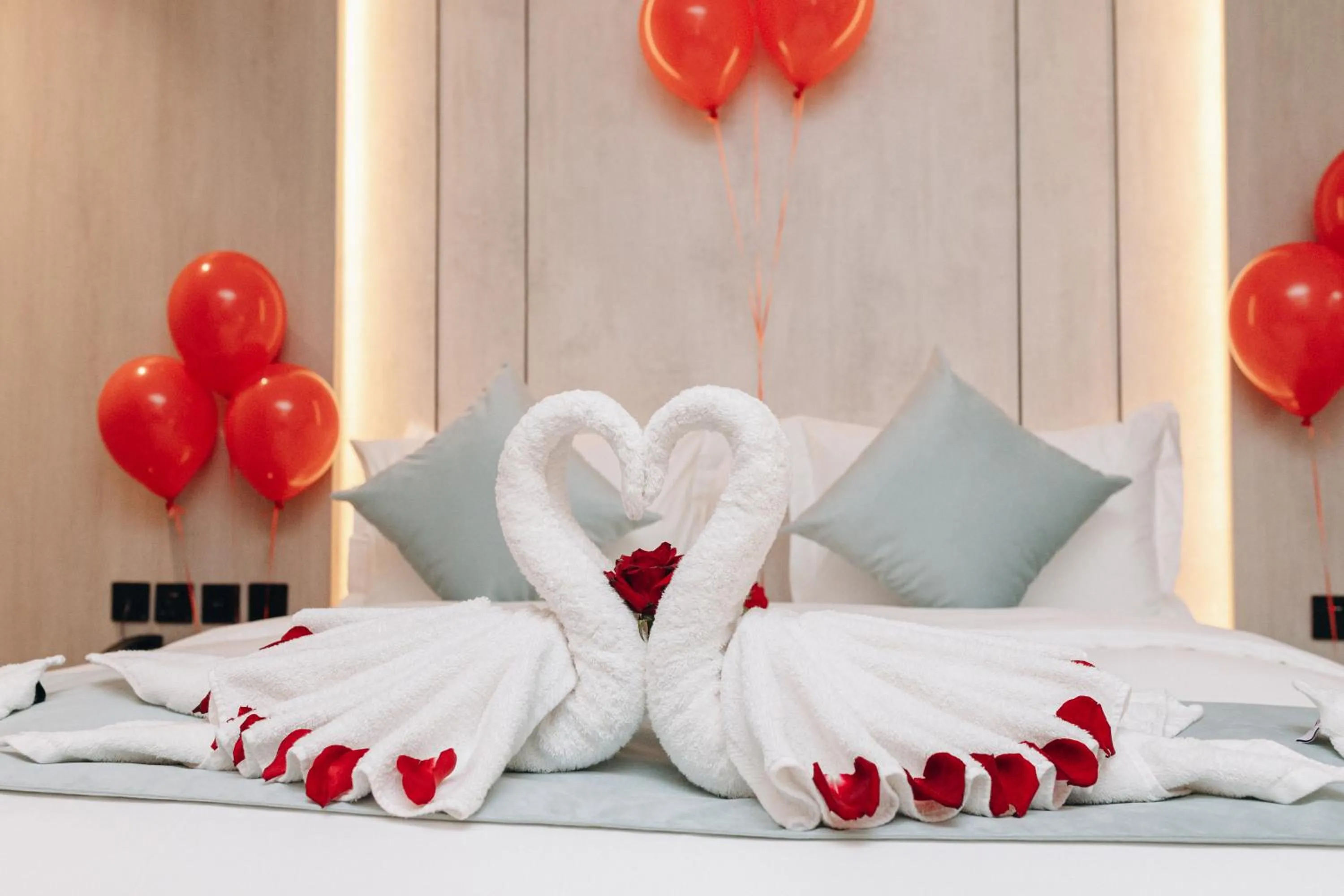 Bed in Rose Garden Hotel فندق روز جاردن