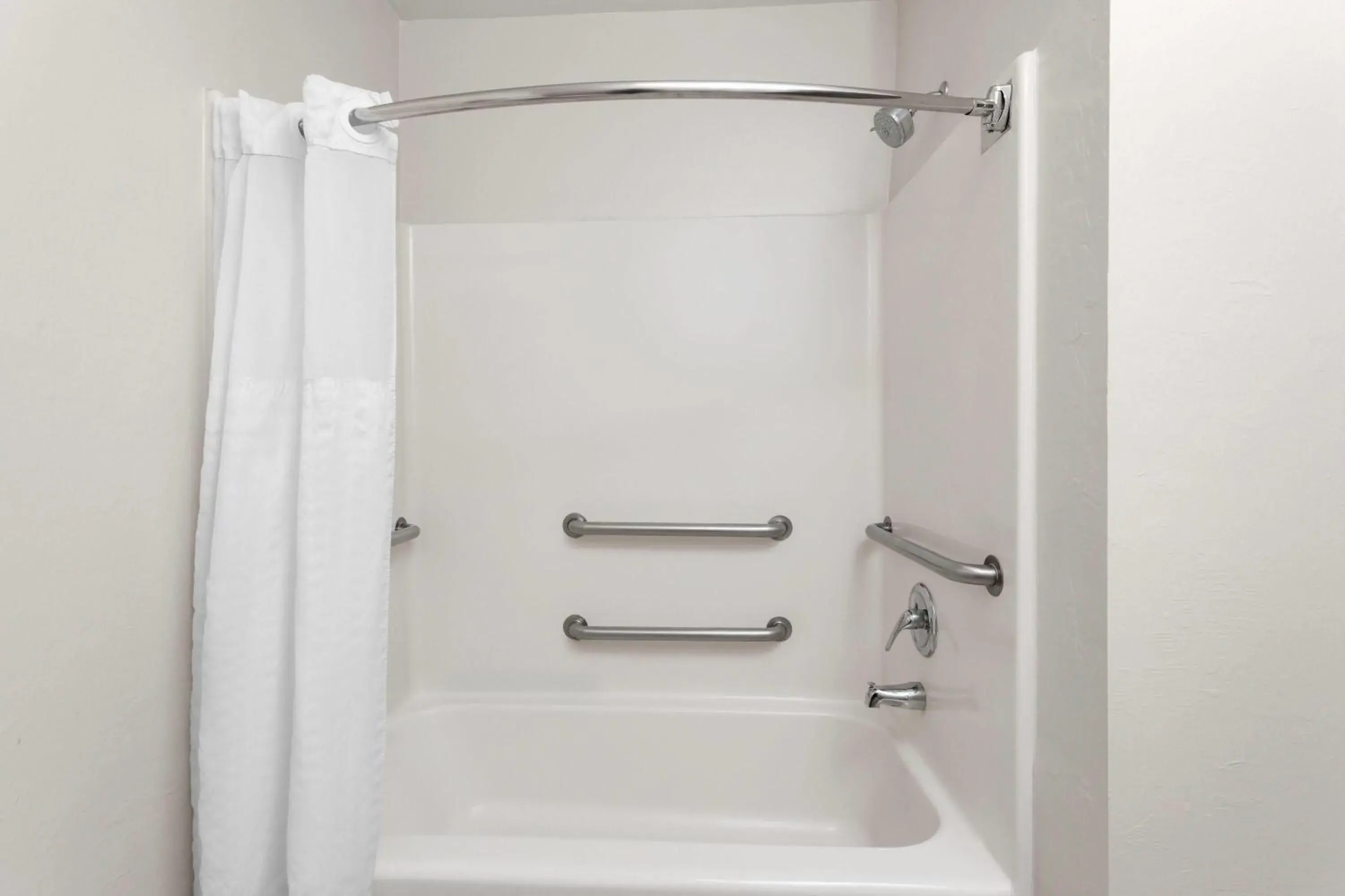 King Room with One King Bed and Bathtub with Grab Bars - Pool View - Accessible - Non-Smoking in Hawthorn Extended Stay by Wyndham Naples King Room with One King Bed and Bathtub with Grab Bars - Pool View - Accessible - Non-Smoking in Hawthorn Extended Stay by Wyndham Naples