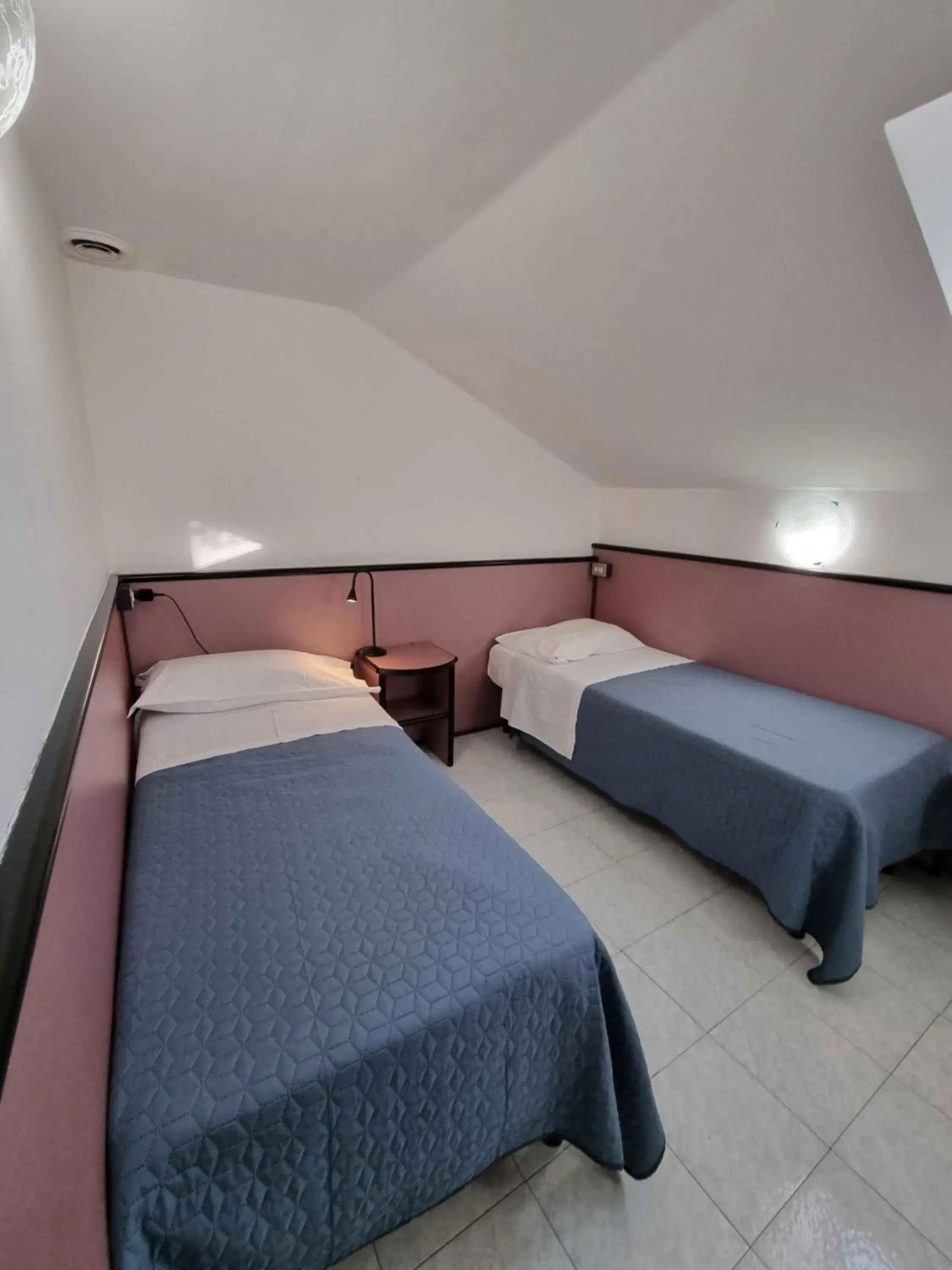 Quadruple Room - Attic in CityHotel Cristina Vicenza Quadruple Room - Attic in CityHotel Cristina Vicenza