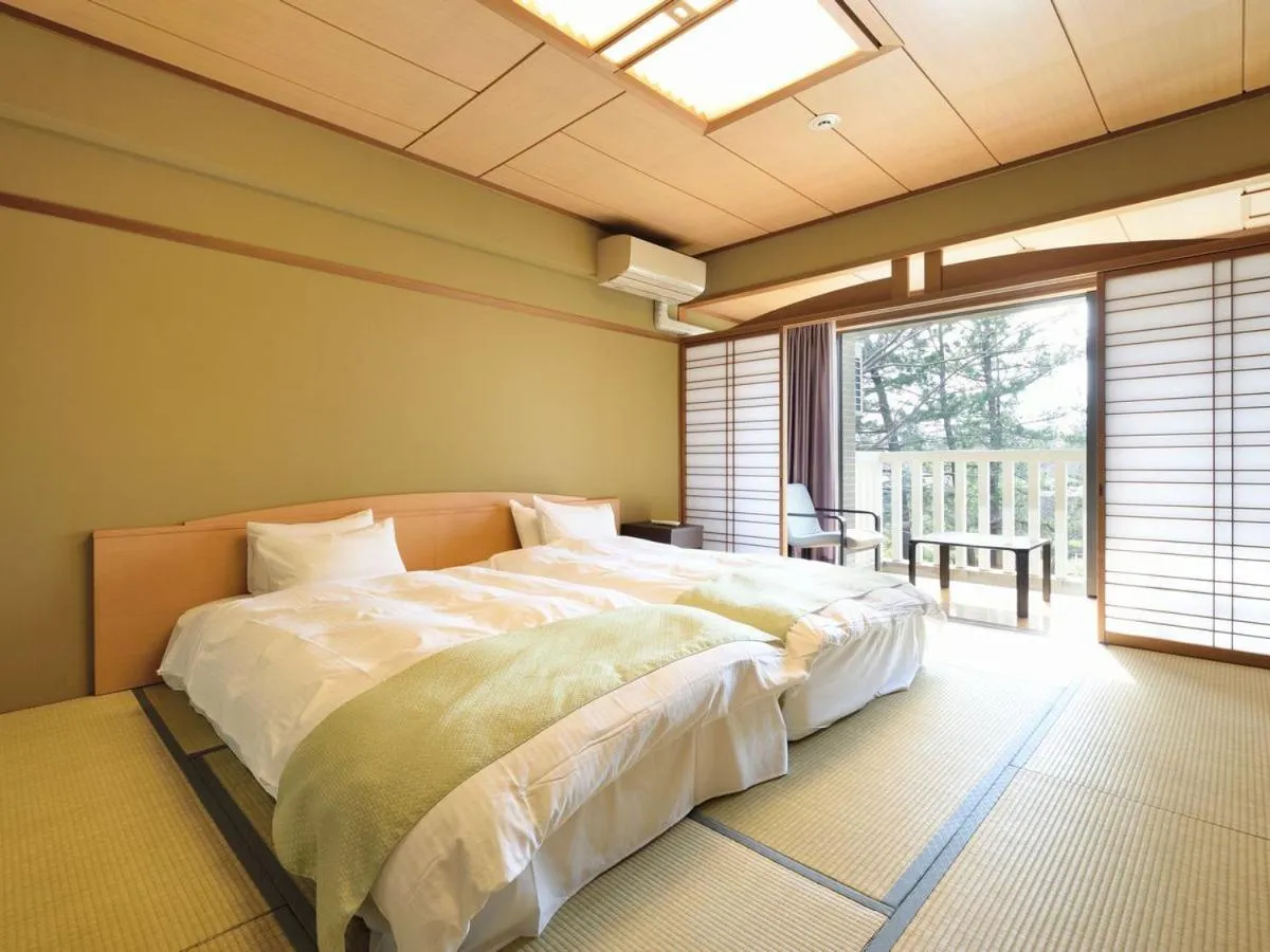 Photo of the whole room, Bed in Hotel Yubana