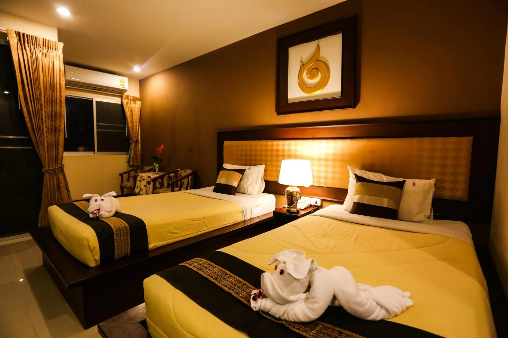 Bed in Madina Rayong Hotel