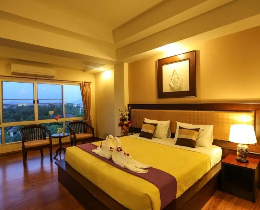 Bed in Madina Rayong Hotel