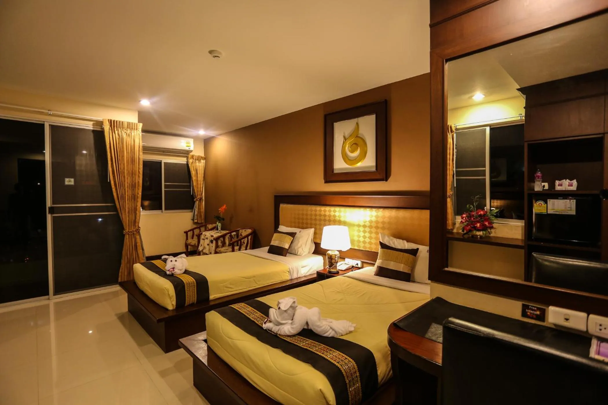 Bed in Madina Rayong Hotel