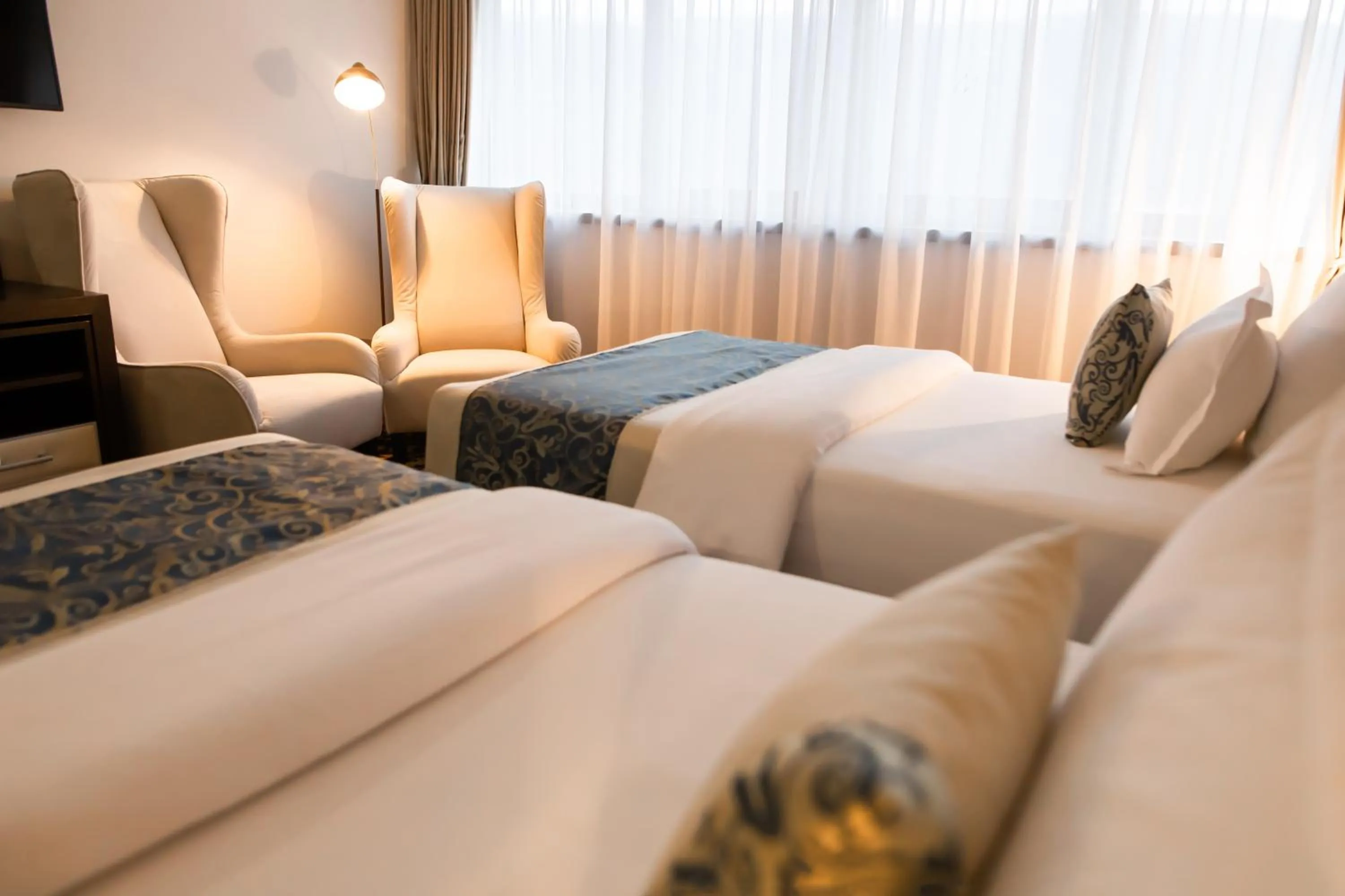 Bed in Malak Regency Hotel