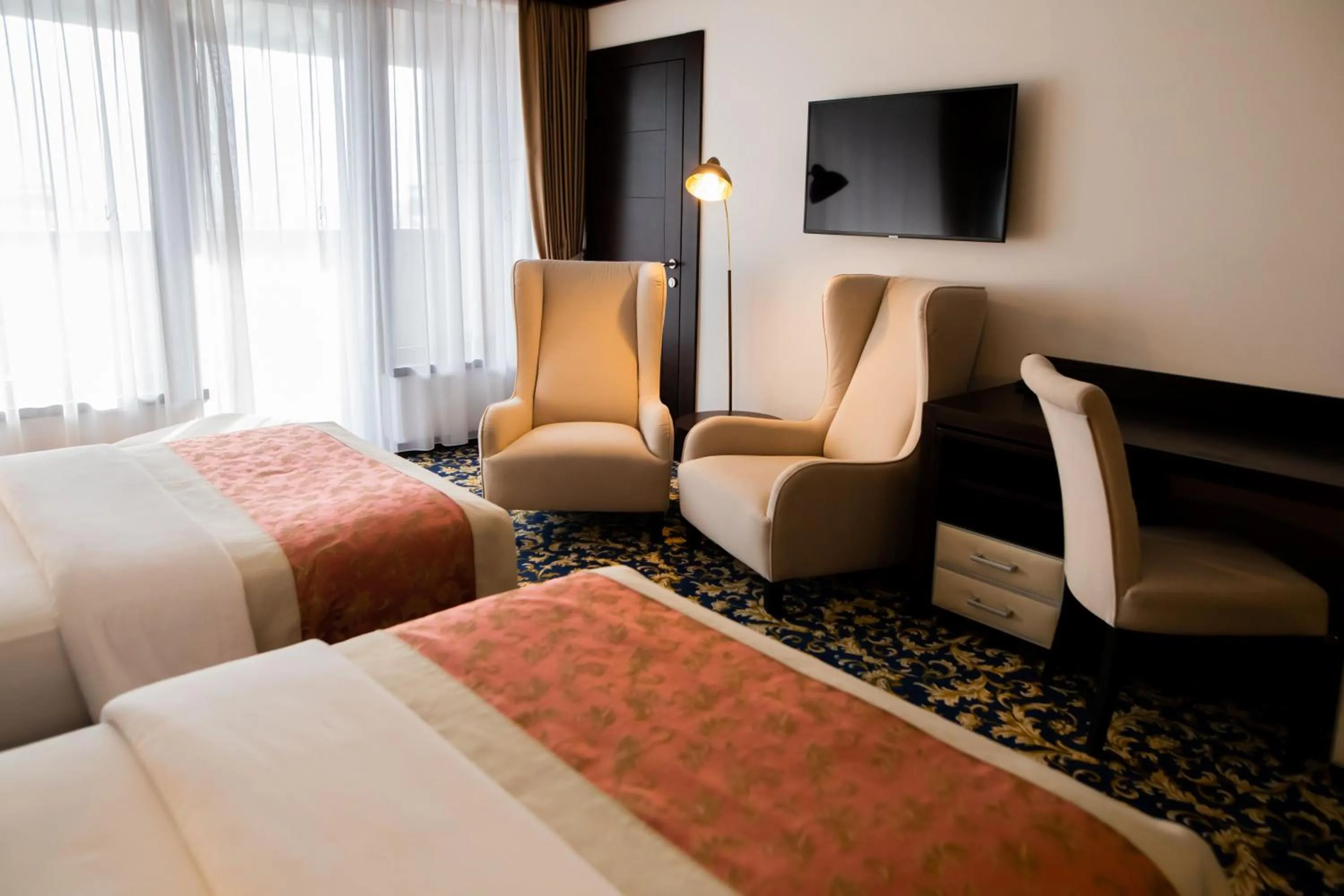 Bed in Malak Regency Hotel