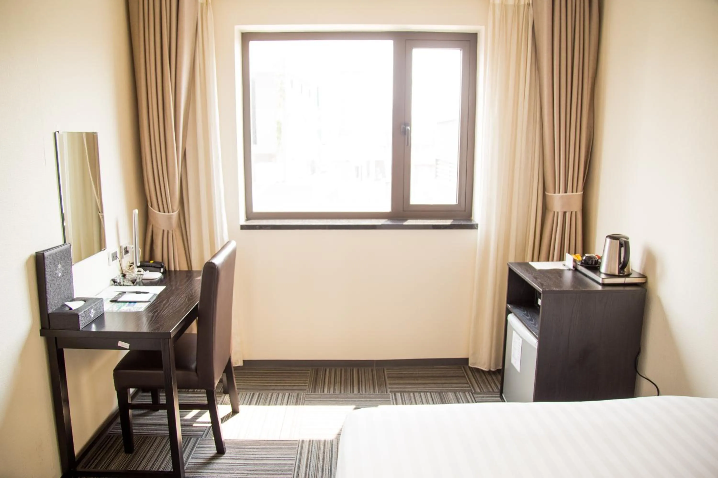 Bed in Sakura Hotel 3