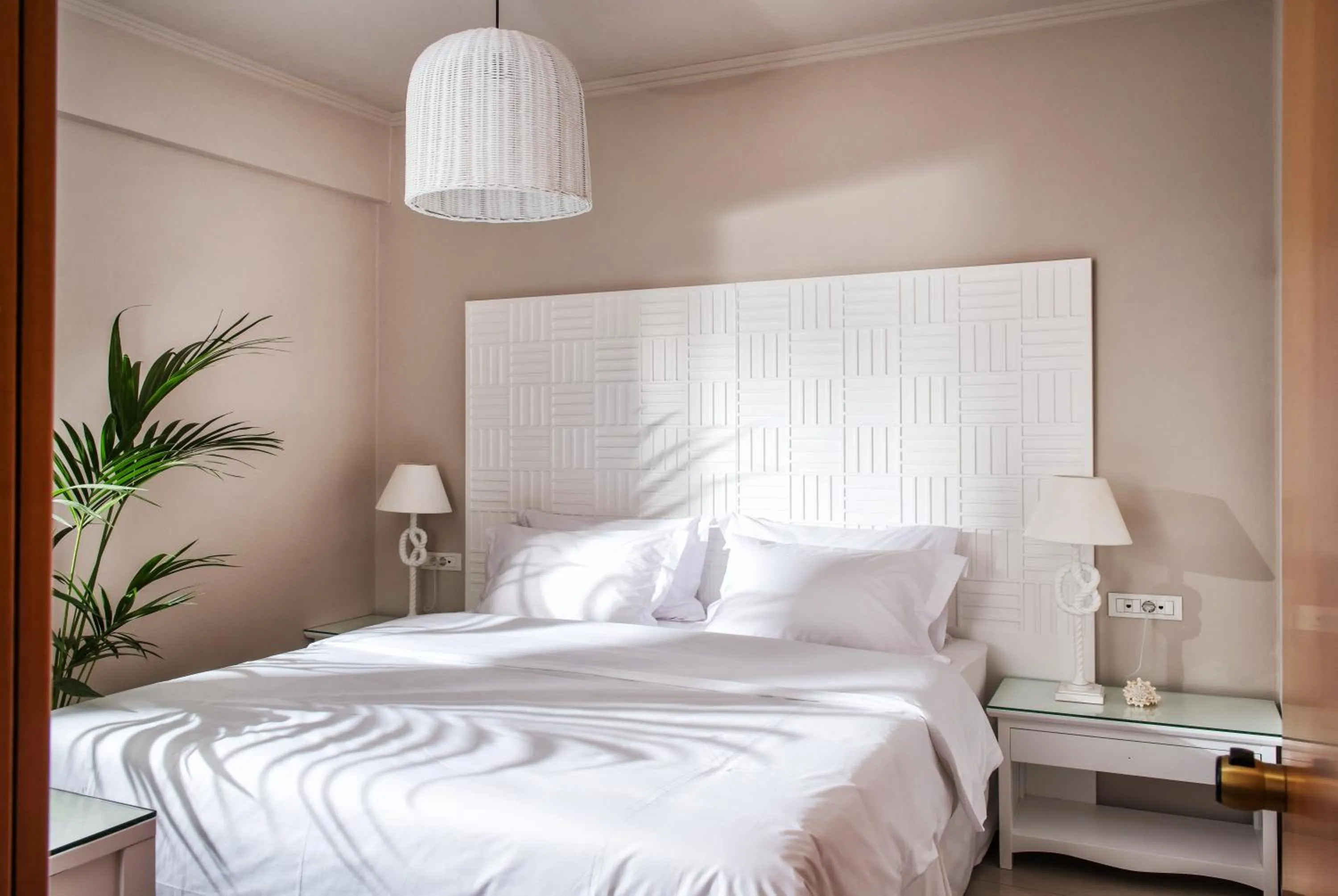 Bed in Notos Heights Hotel & Suites