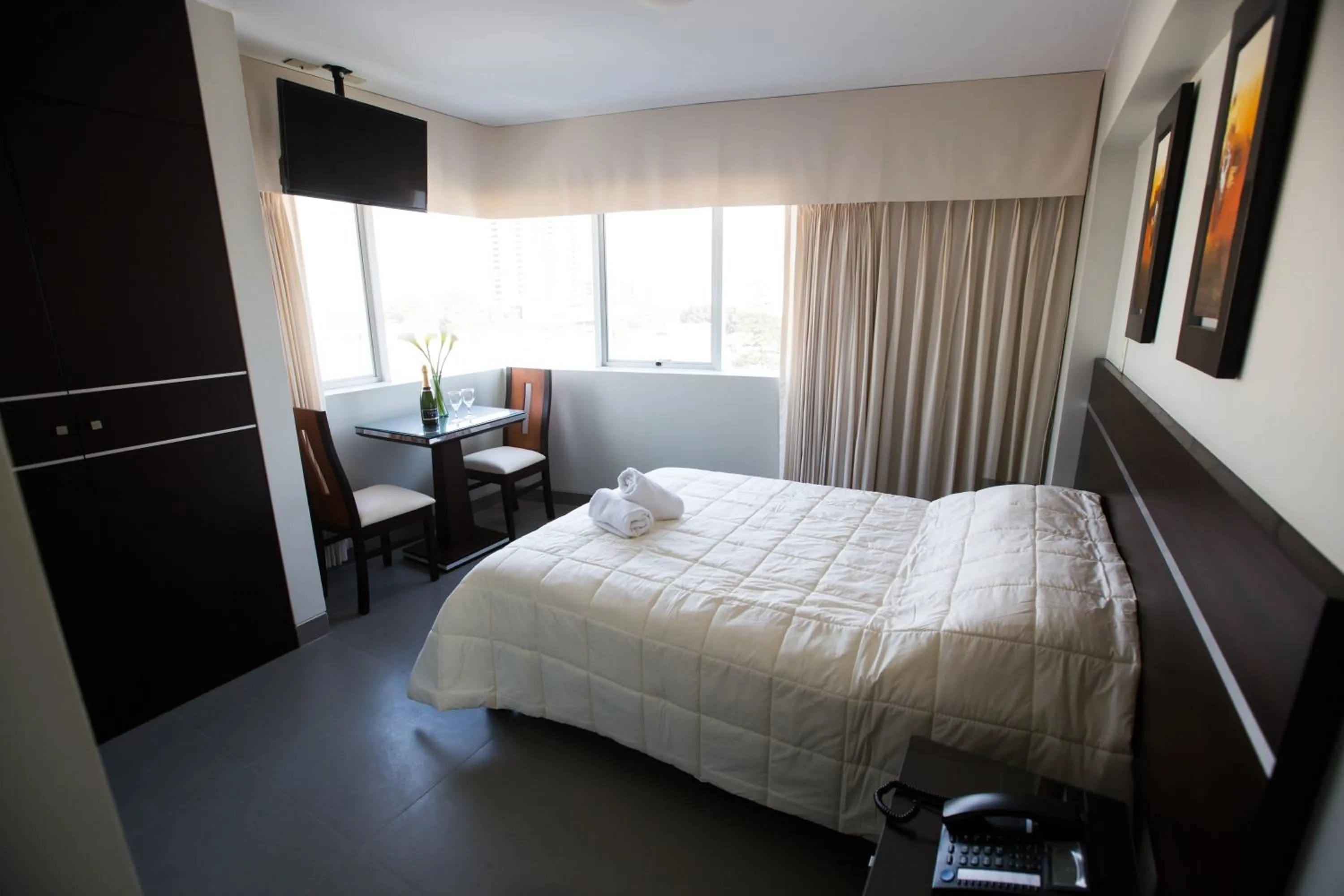 Photo of the whole room, Bed in Mariategui Hotel & Suites