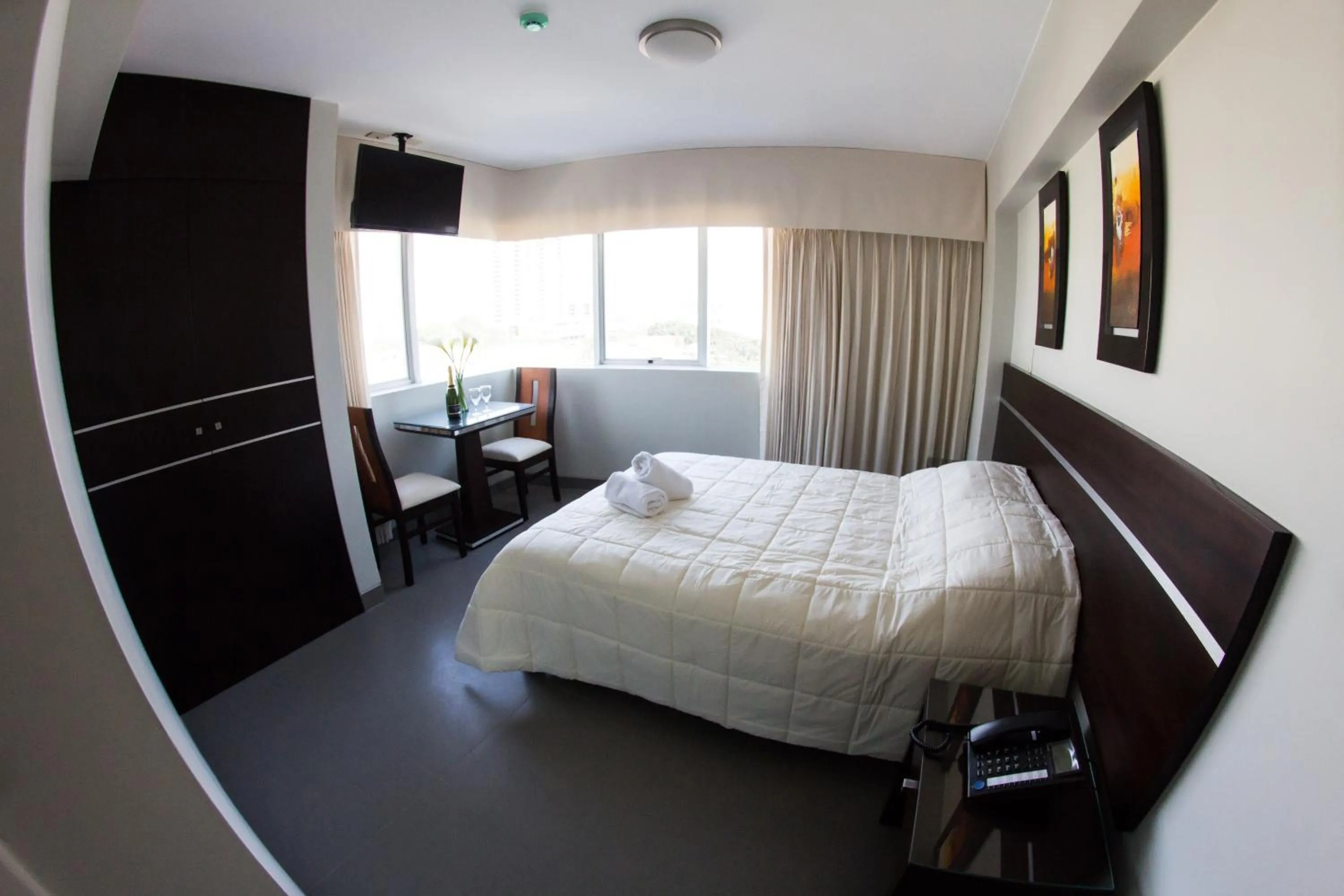 Bed in Mariategui Hotel & Suites