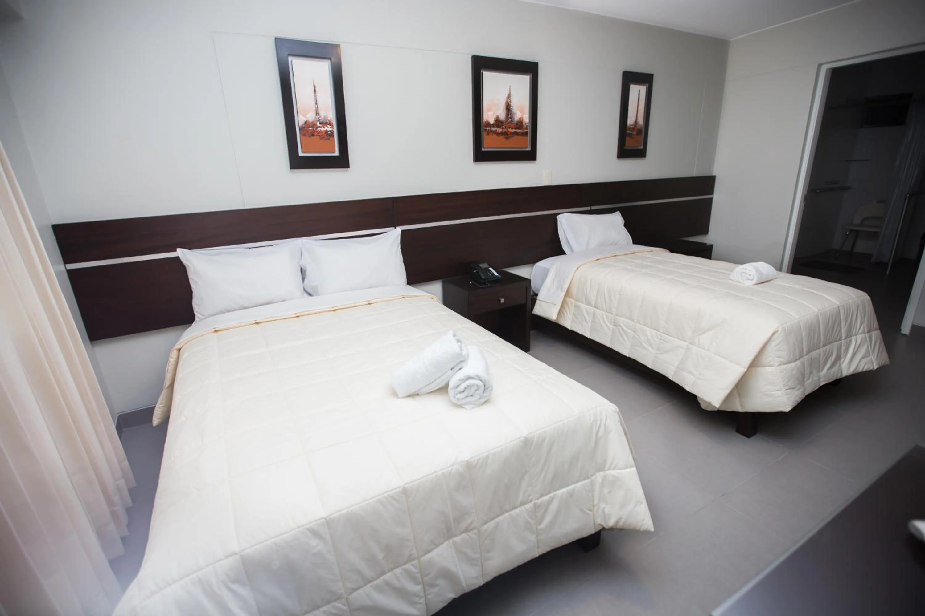 Bed in Mariategui Hotel & Suites