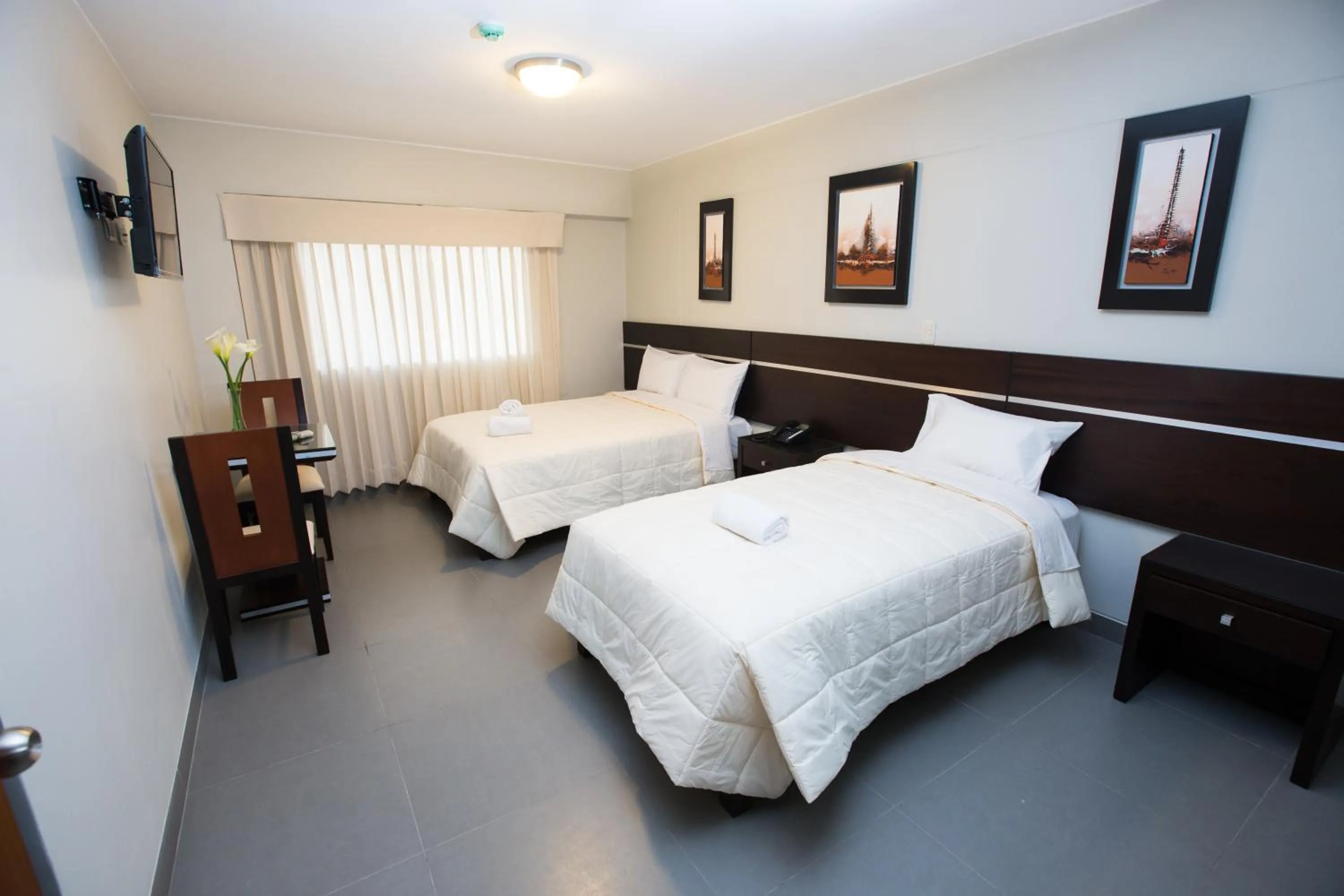 Photo of the whole room, Bed in Mariategui Hotel & Suites