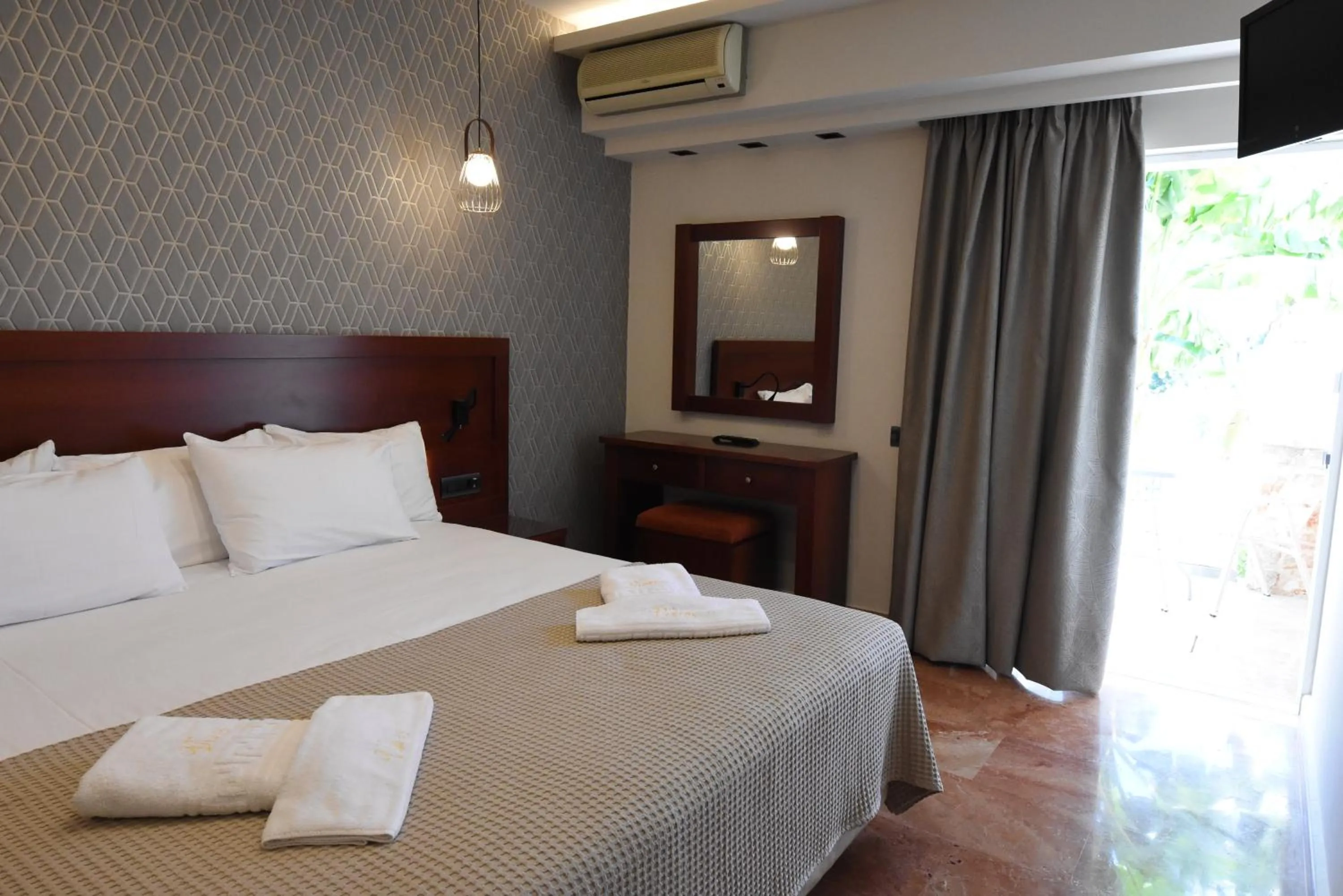 Bed in Viaros Hotel Apartments