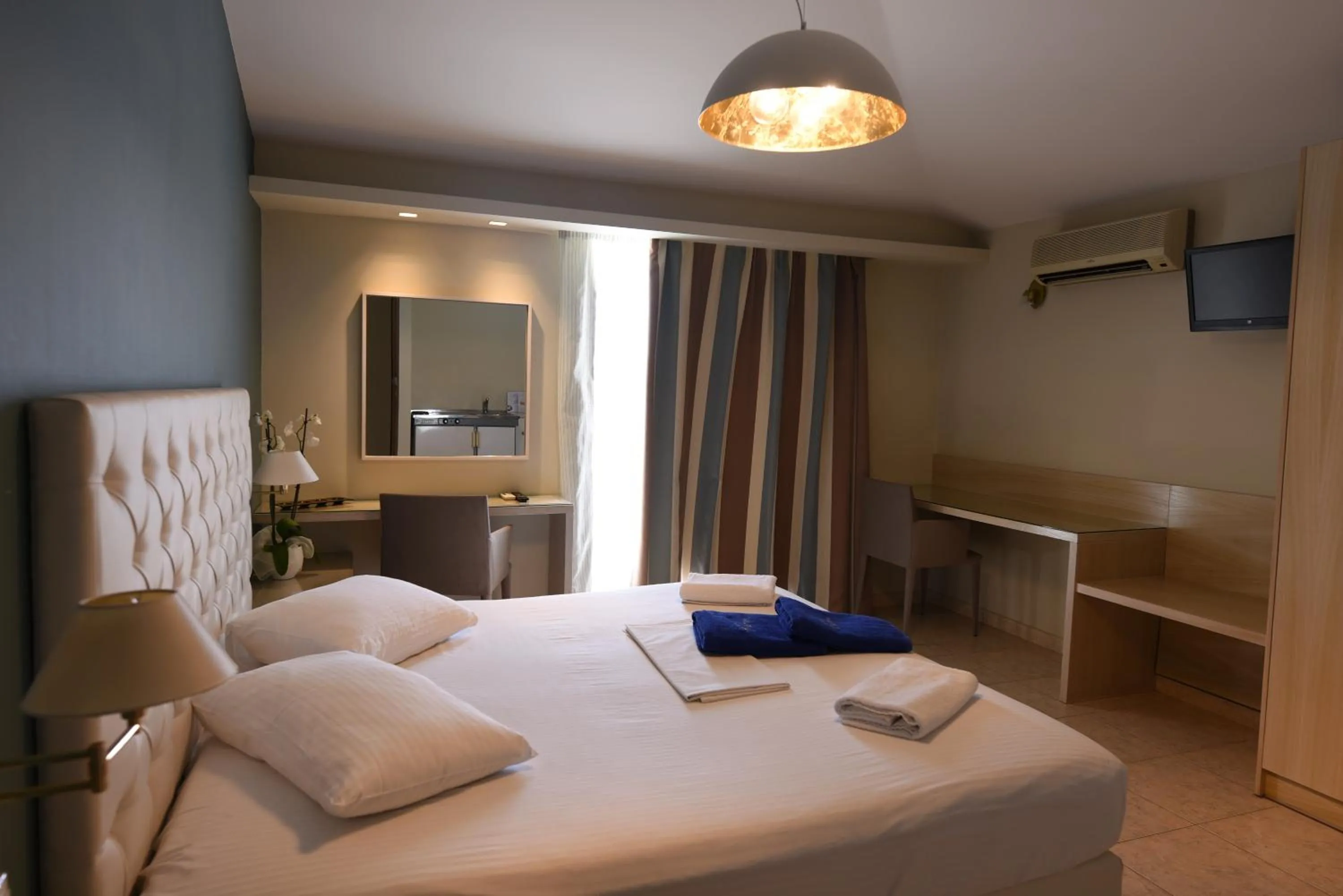 Bed in Viaros Hotel Apartments