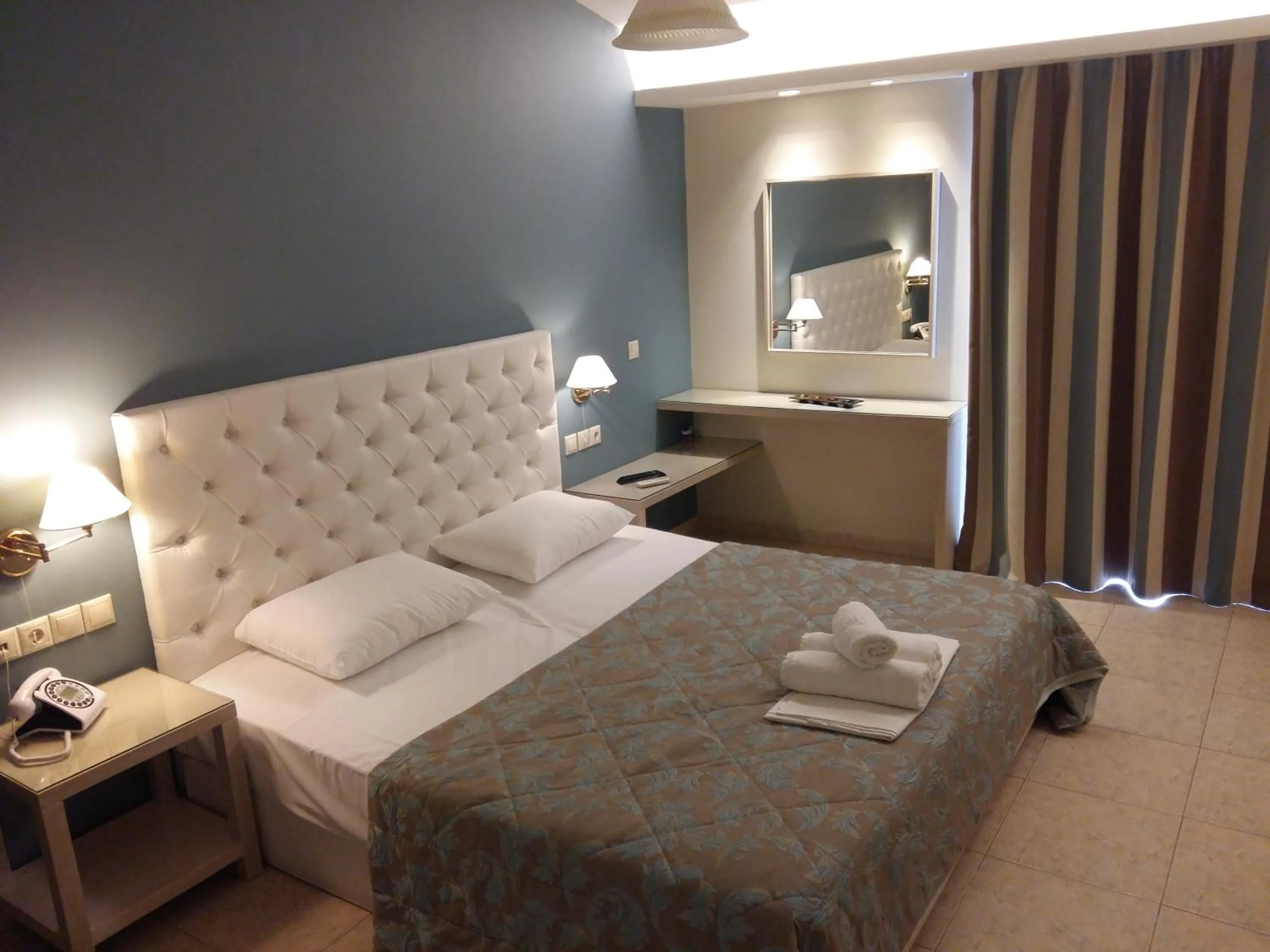 Bed in Viaros Hotel Apartments