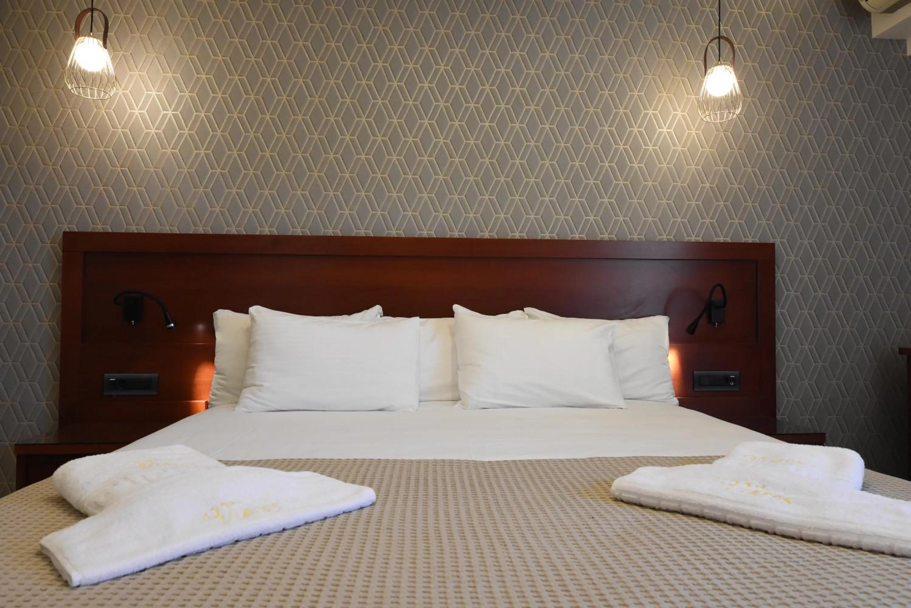 Bed in Viaros Hotel Apartments