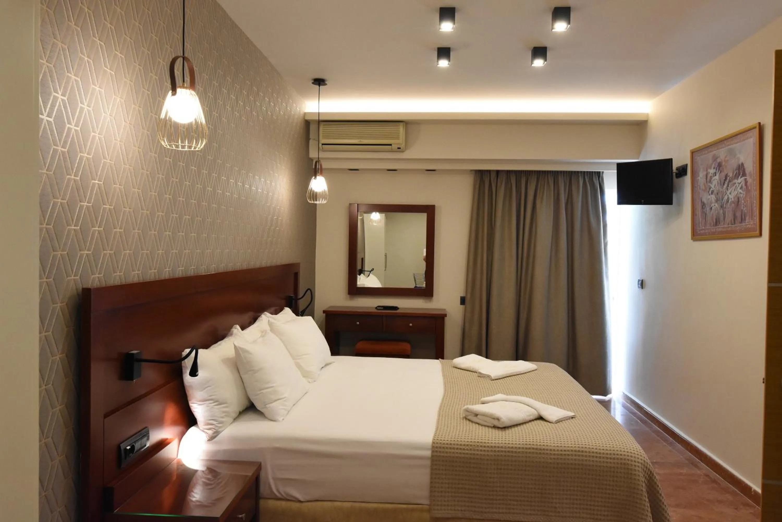 Bed in Viaros Hotel Apartments