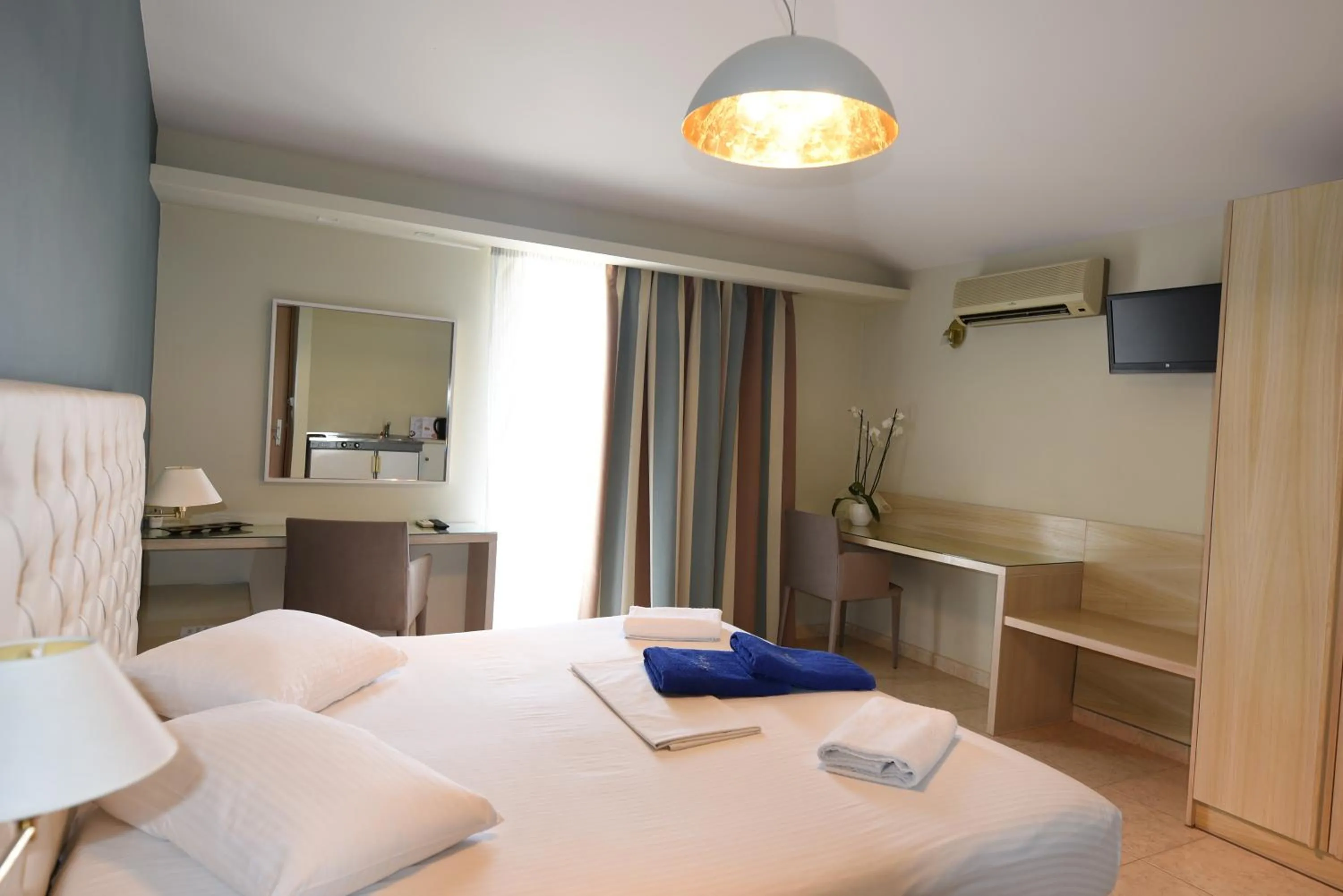 Bed in Viaros Hotel Apartments