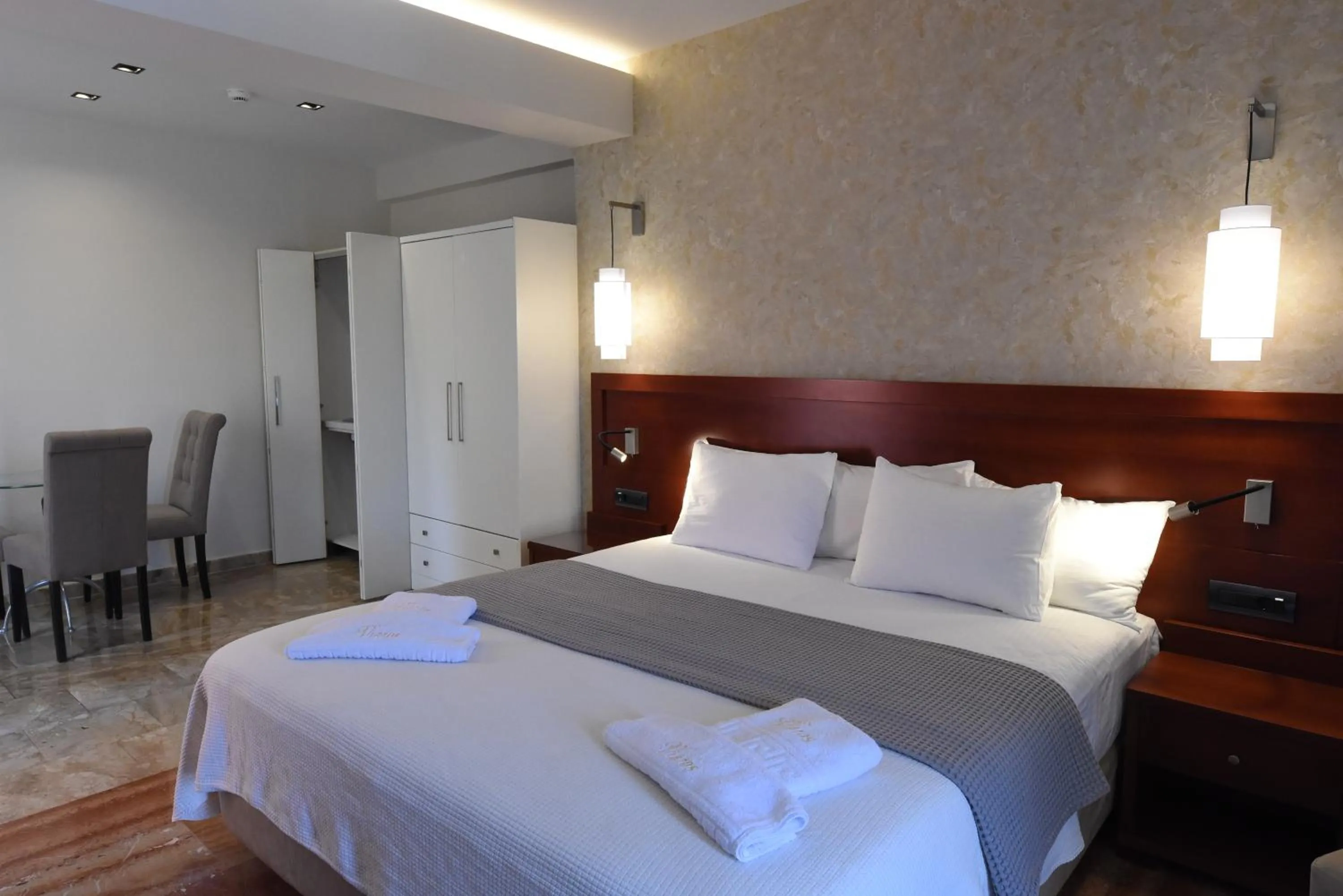 Bed in Viaros Hotel Apartments