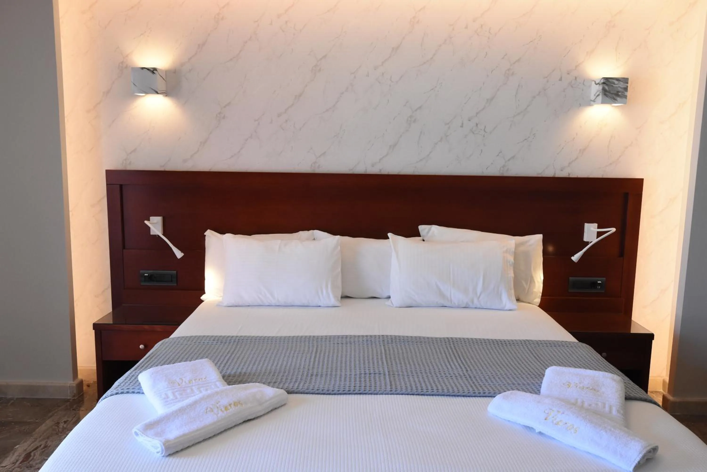 Bed in Viaros Hotel Apartments