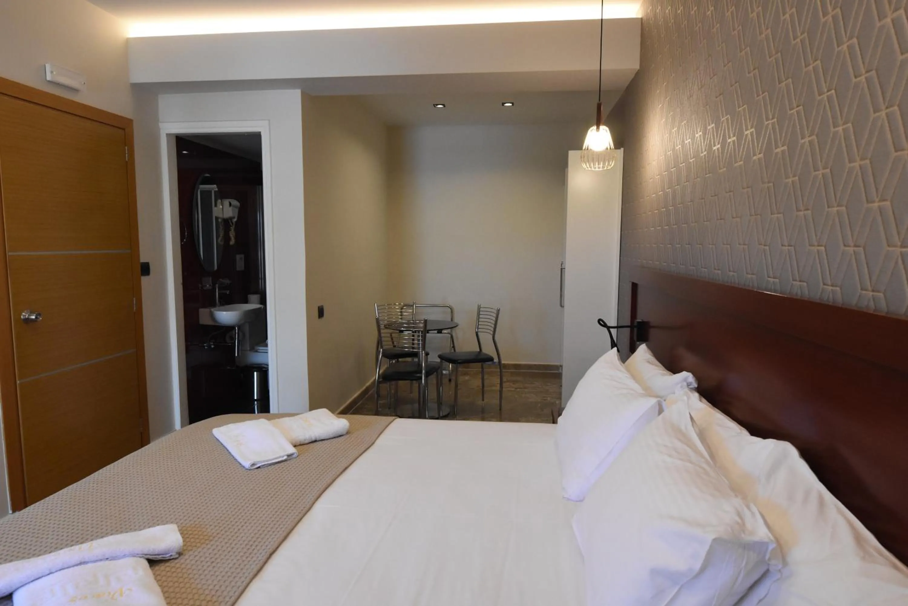 Bed in Viaros Hotel Apartments