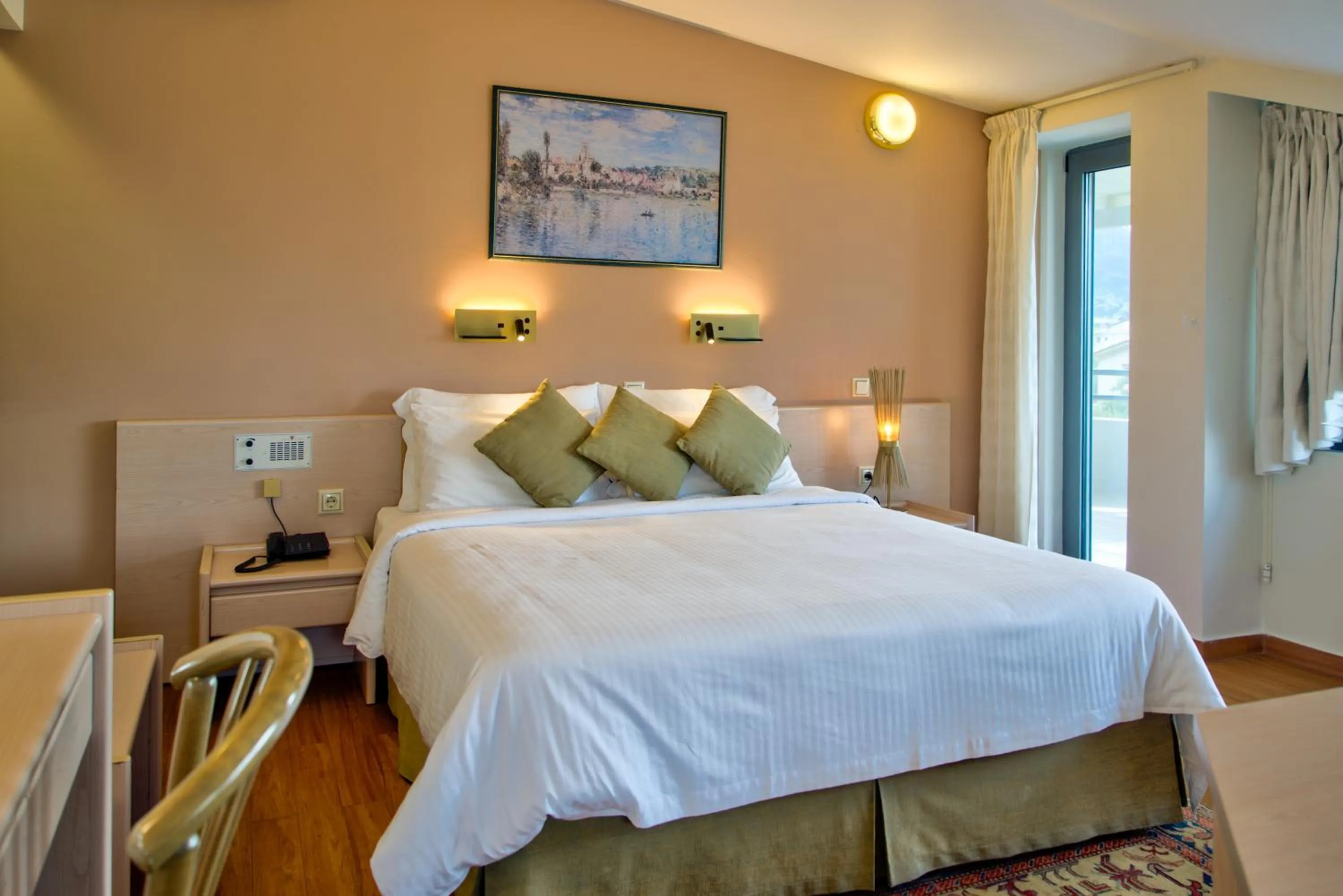 Bed in Poseidon Hotel