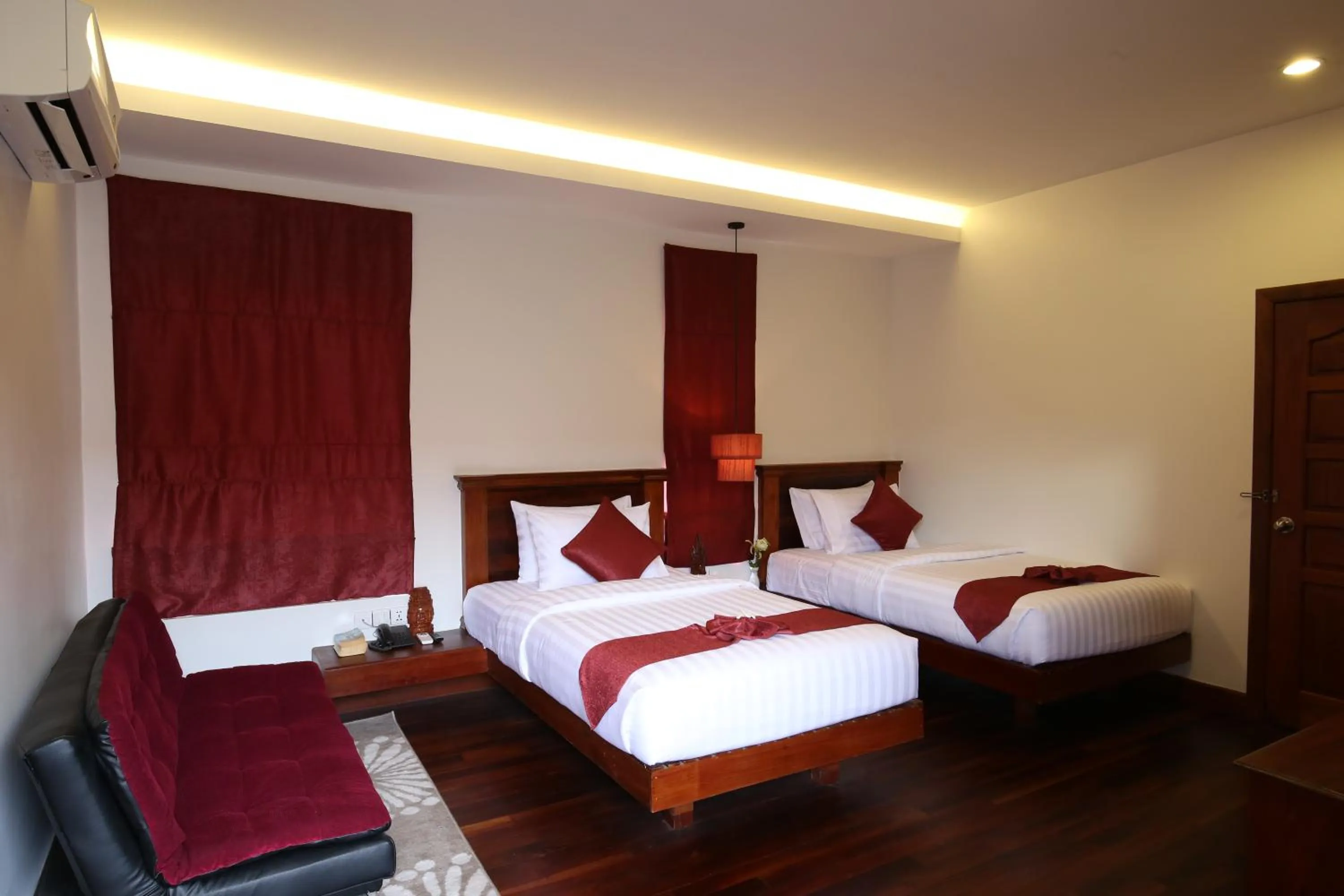 Bed in Holy Angkor Hotel