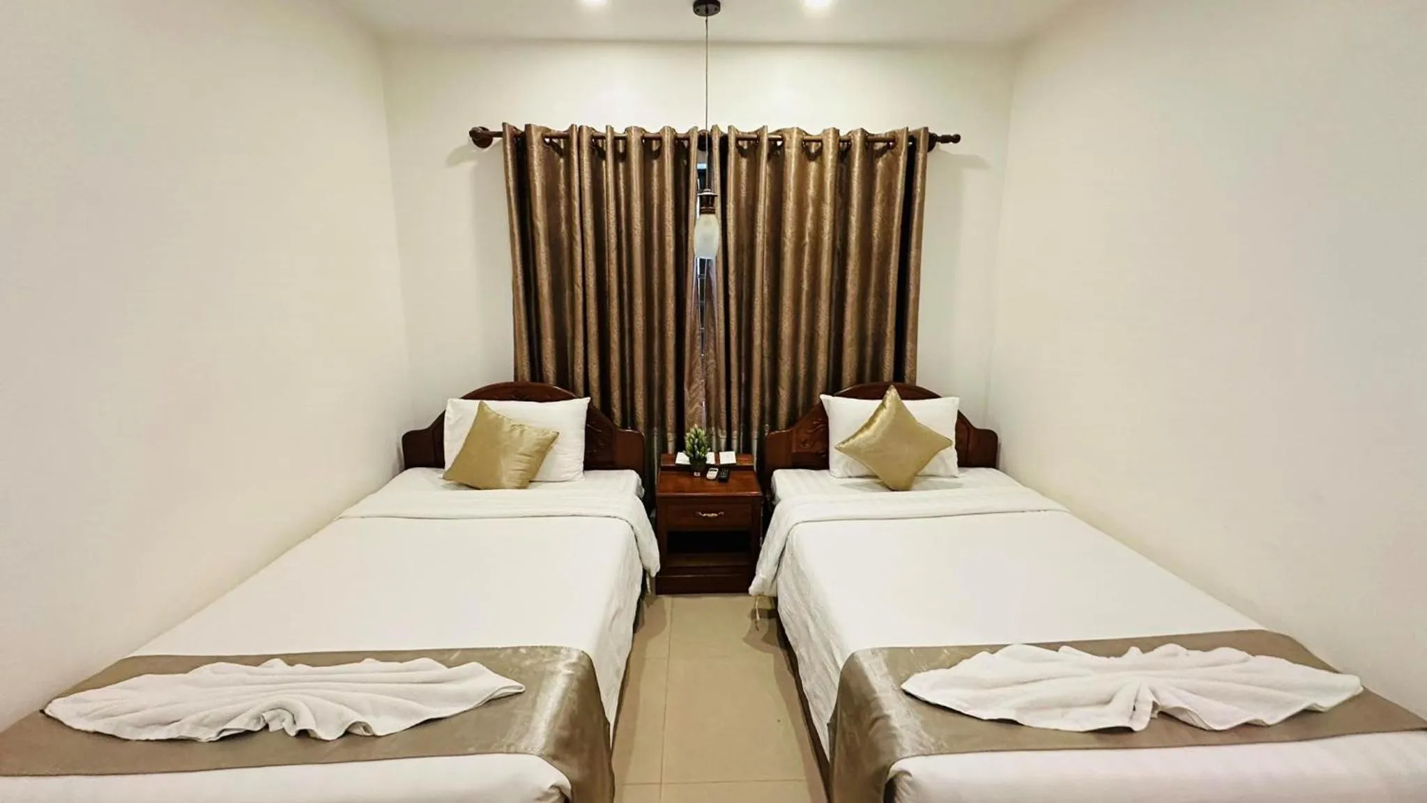 Bed in Holy Angkor Hotel