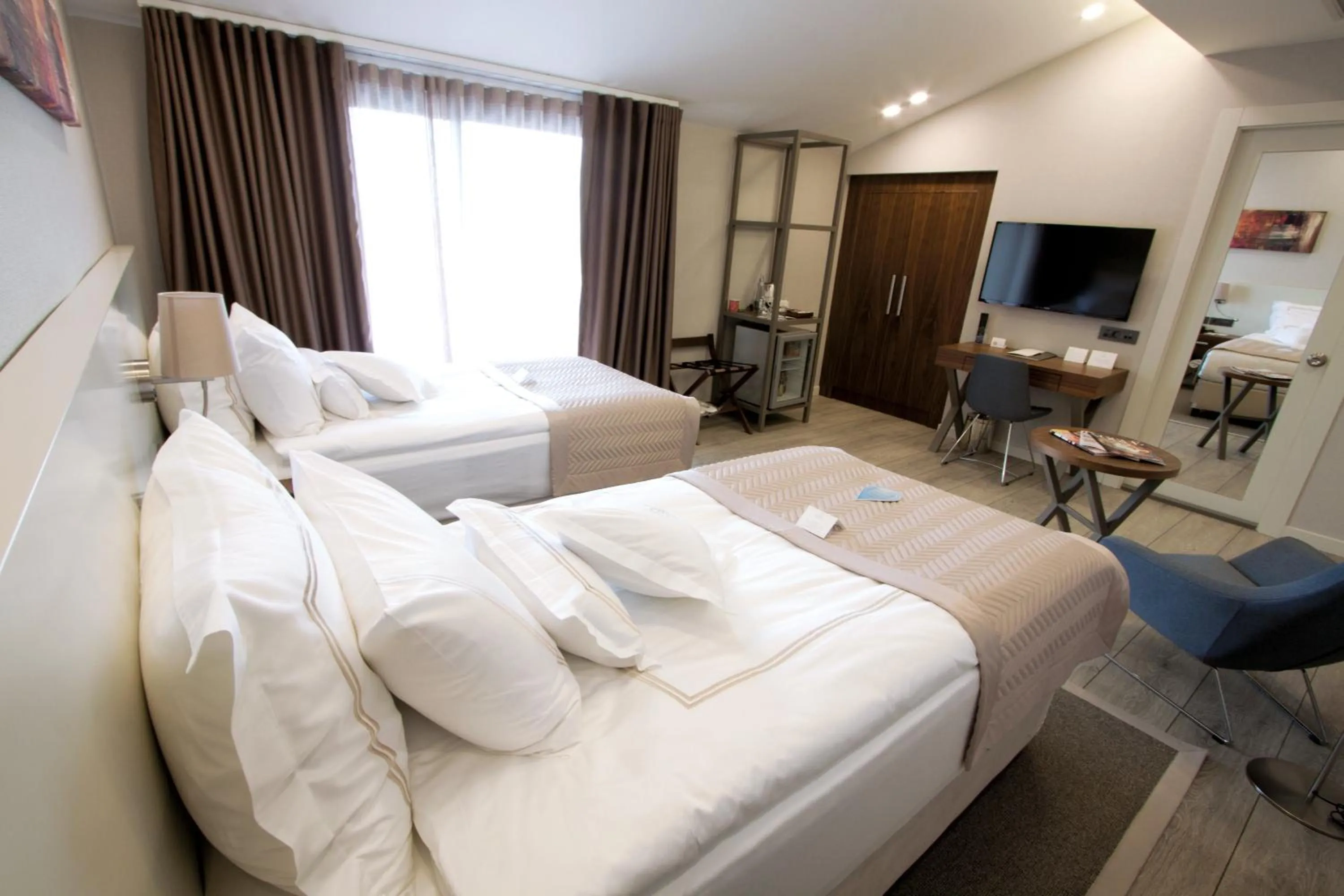 Bed in Casa Bianca Hotel