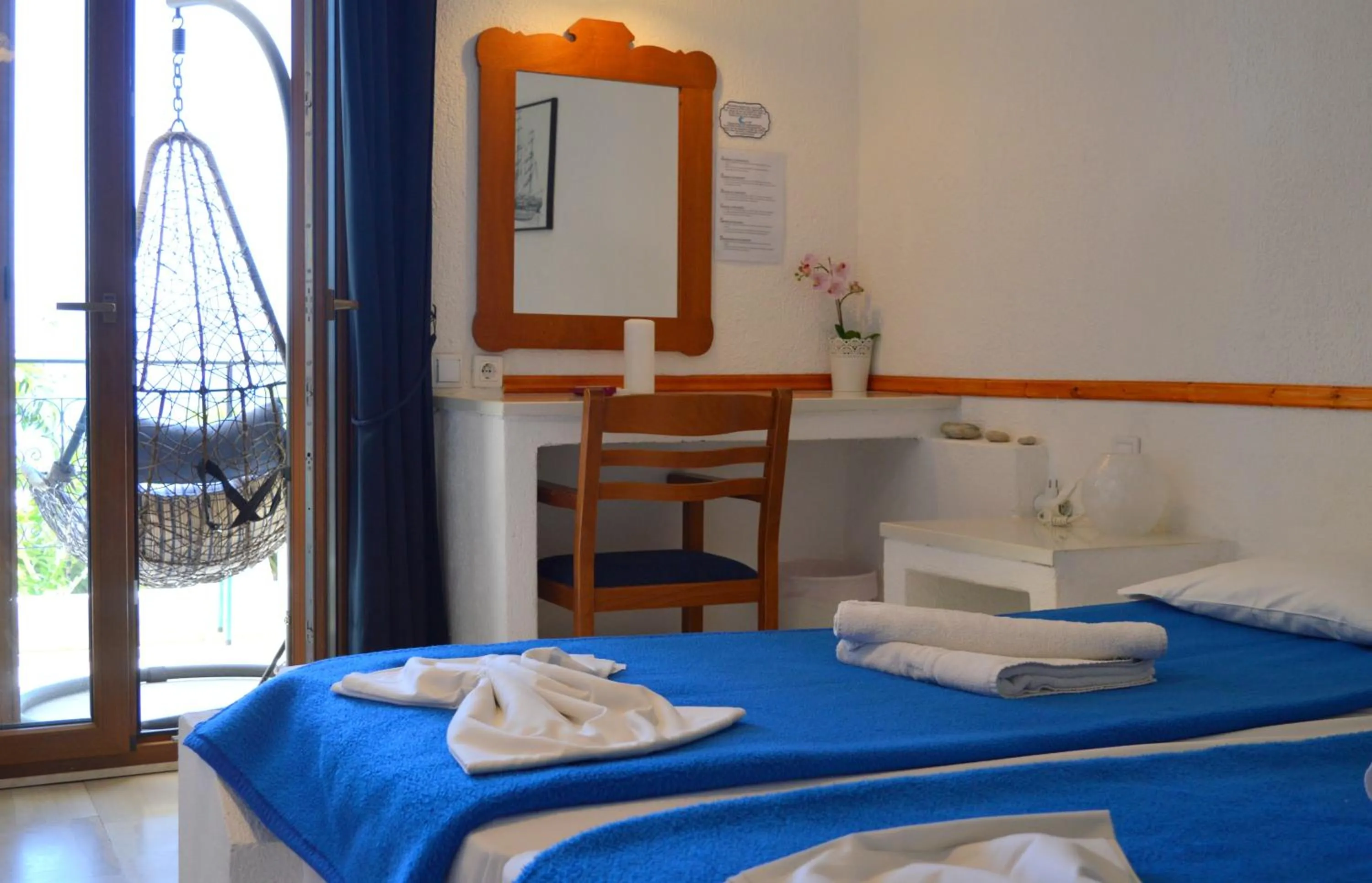 Bed in Mantraki Hotel Apartments