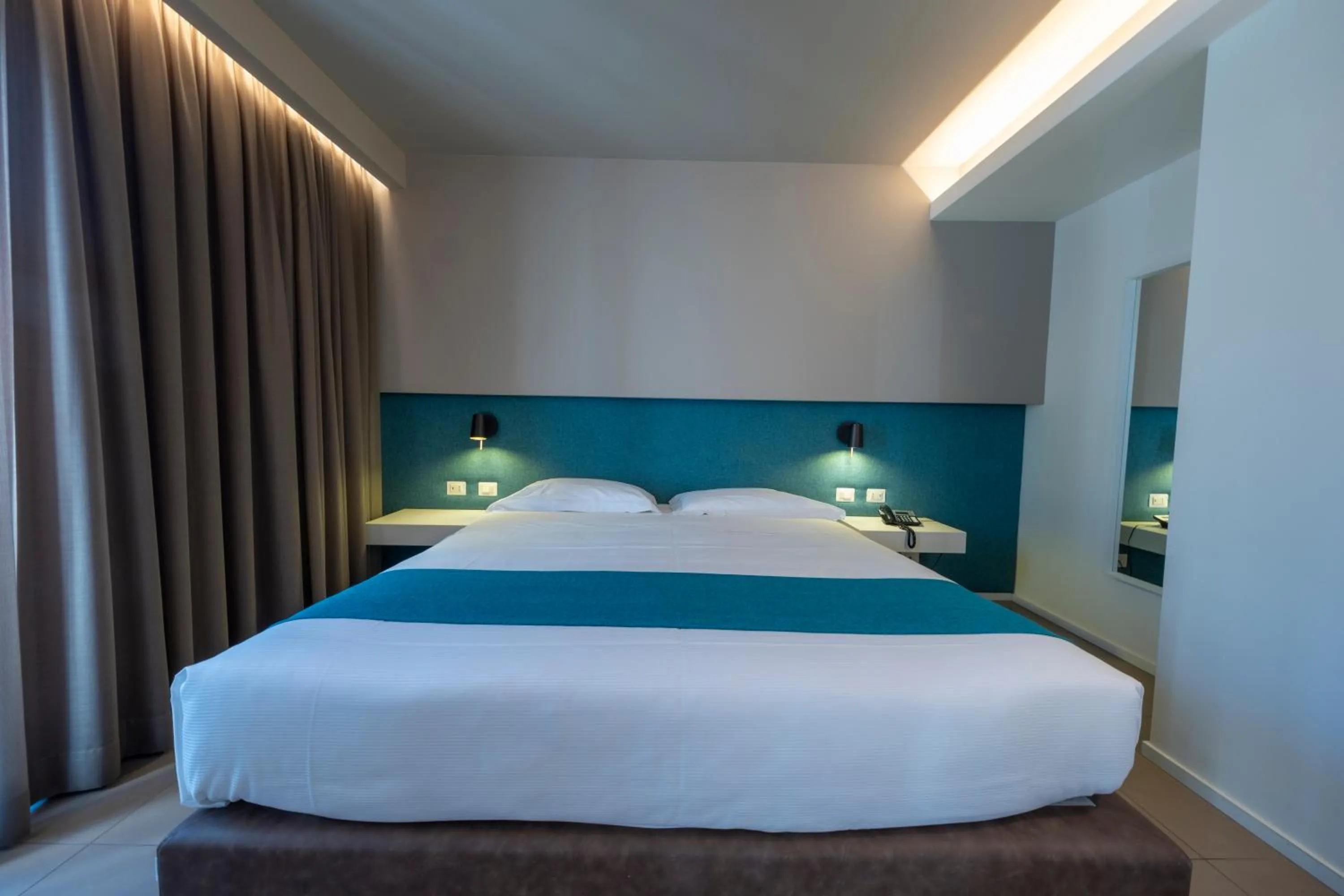 Bed in Airone City Hotel