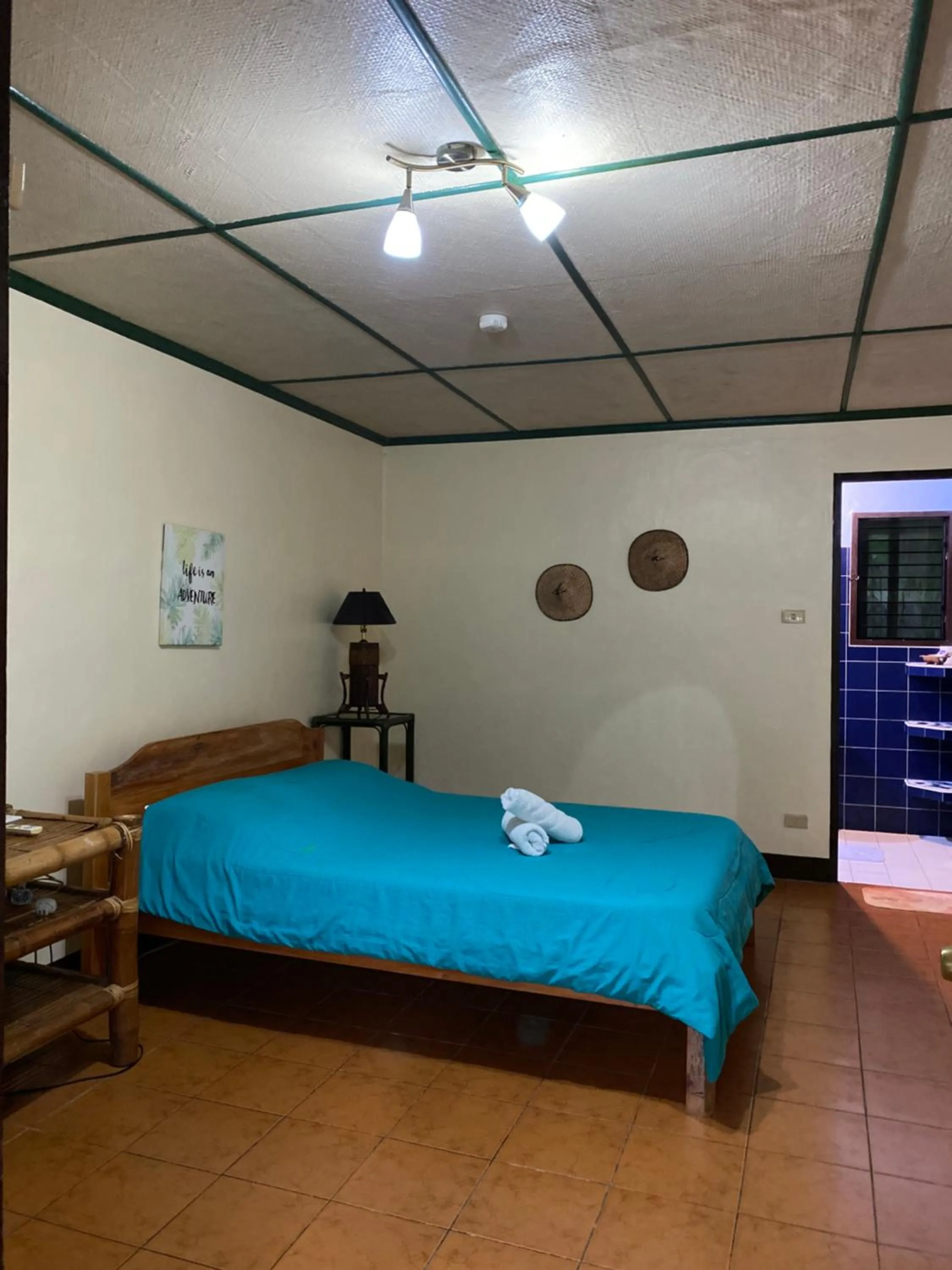 Bed in Ravenala Beach Bungalows