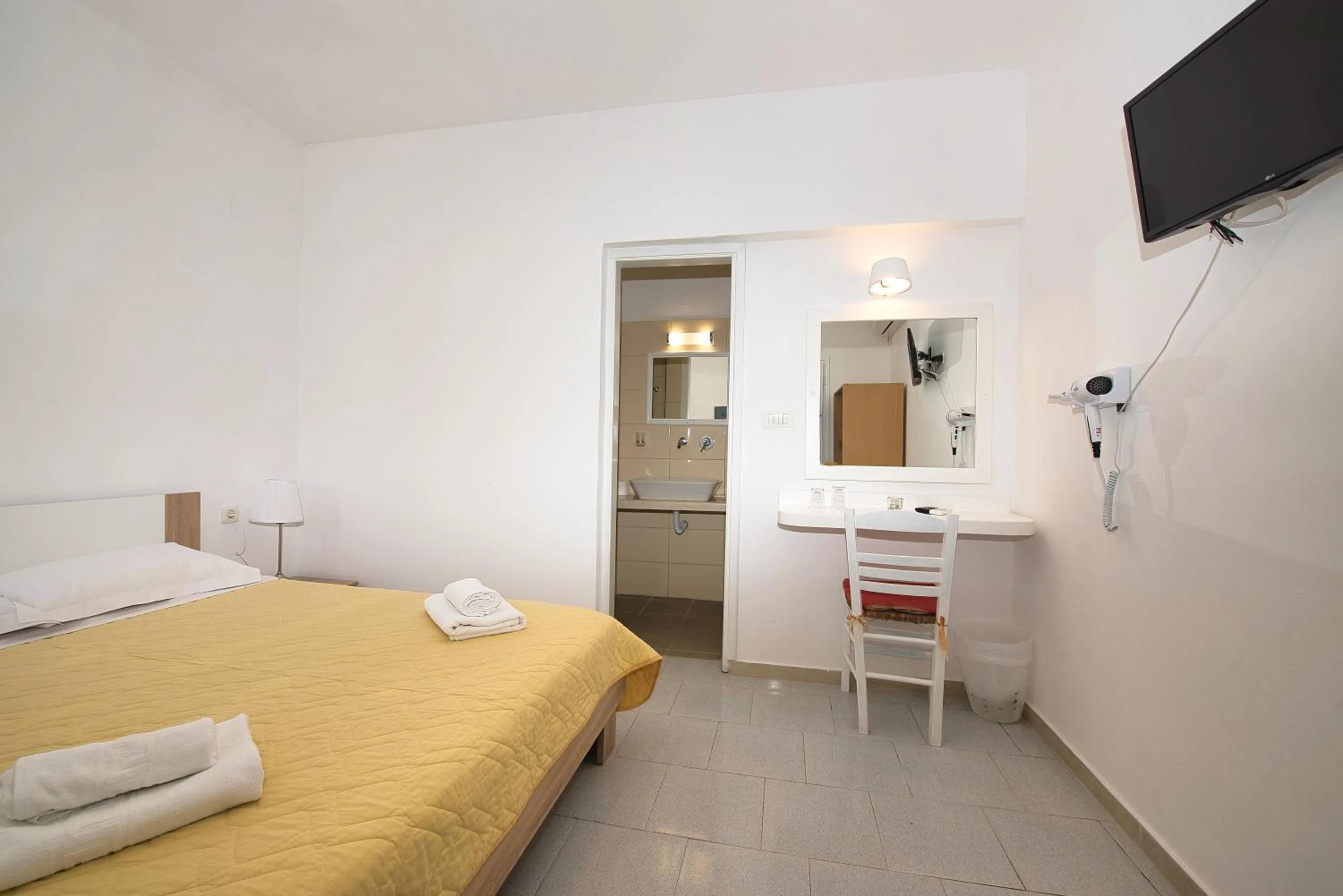 Photo of the whole room, Bed in Caldera View Resort - Adults Only