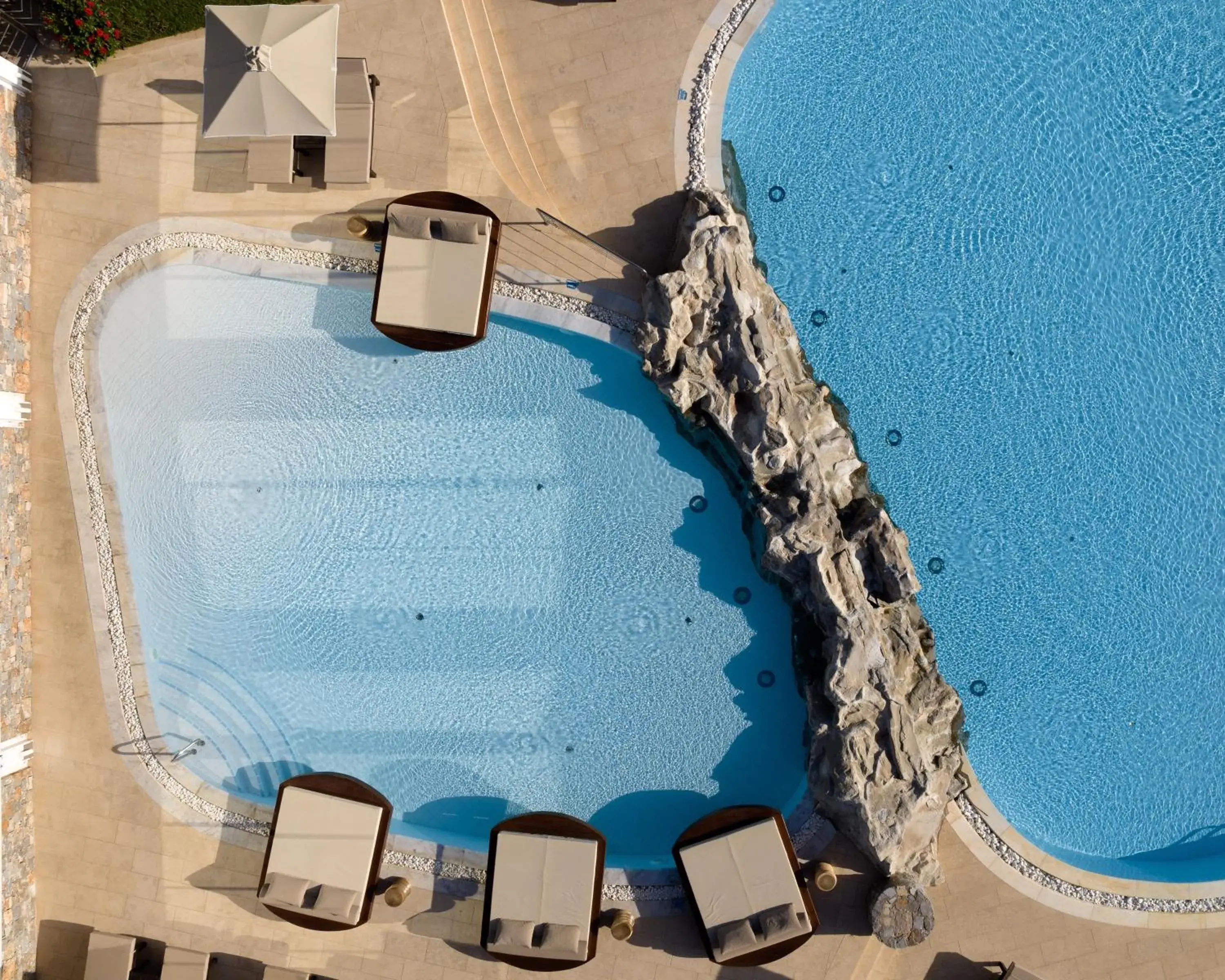 Swimming pool in Ikaros Beach, Luxury Resort & Spa - Adults Only Swimming pool in Ikaros Beach, Luxury Resort & Spa - Adults Only