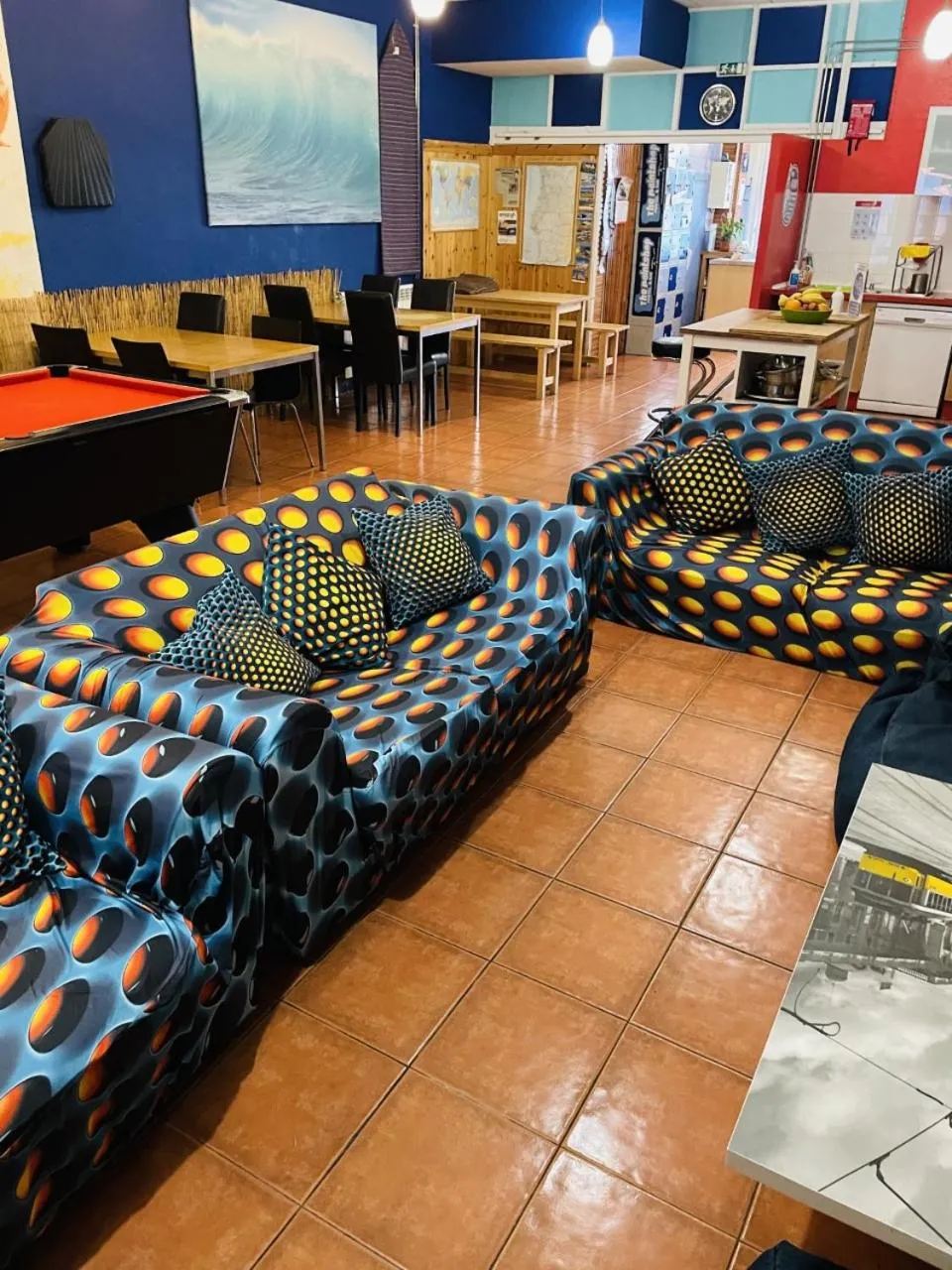 Communal lounge/ TV room in The Paintshop Hostel