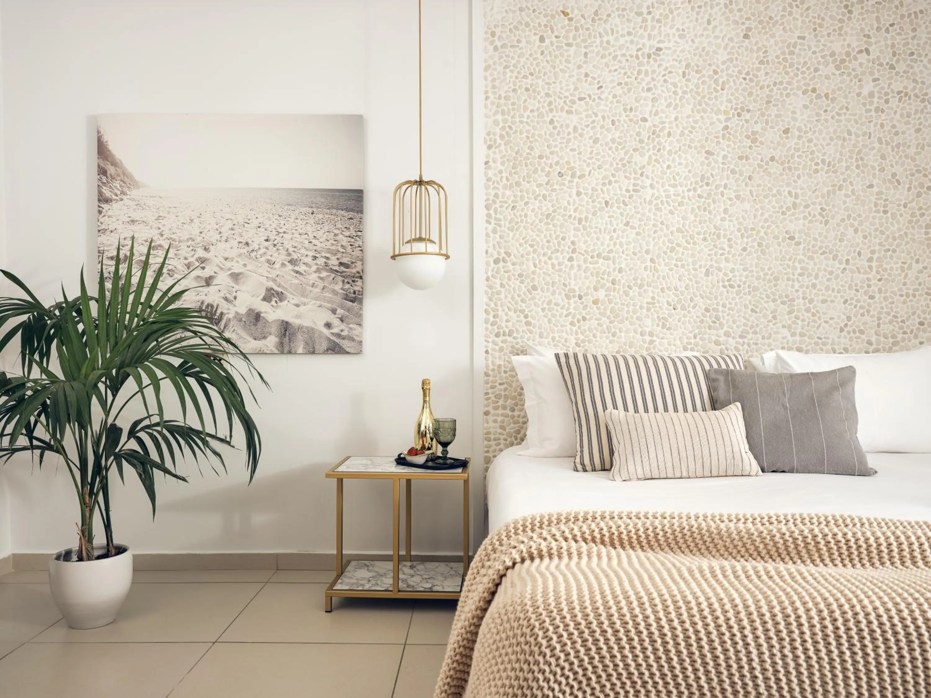 Bed in The Royal Blue a Luxury Beach Resort