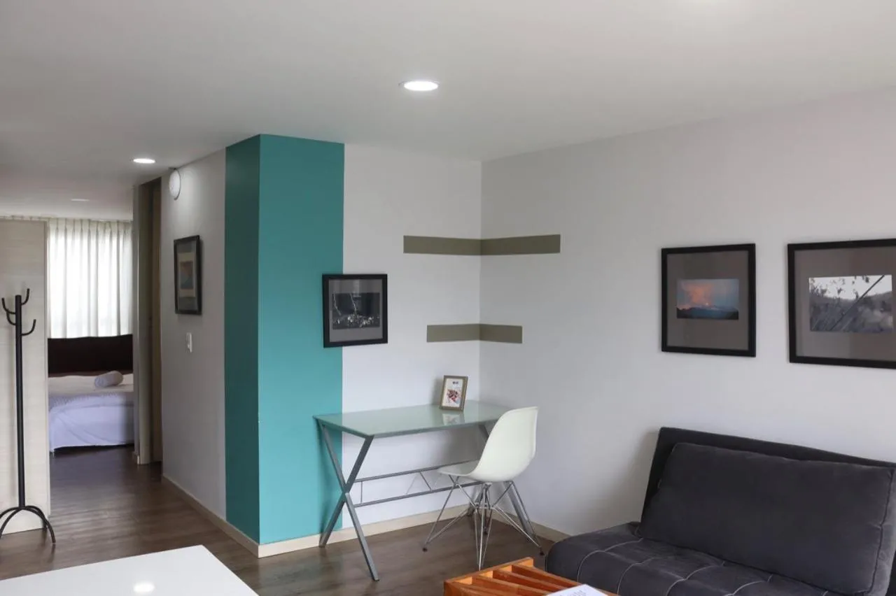 Living room, Bed in Apartahotel Millennials