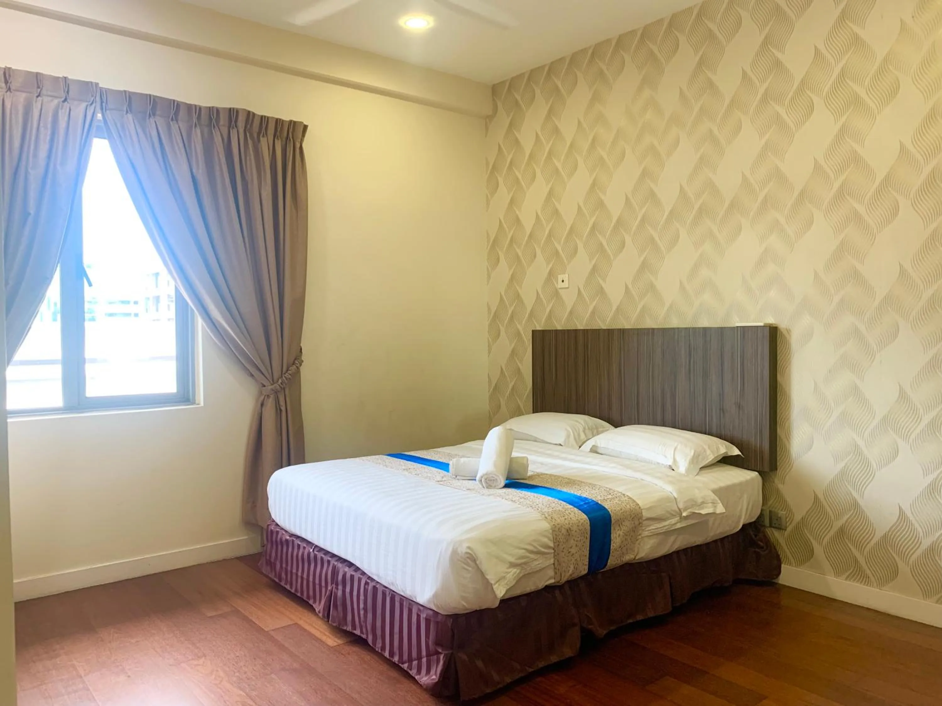 Bed in Sunset Seaview Vacation Condos @ IMAGO Shopping Mall