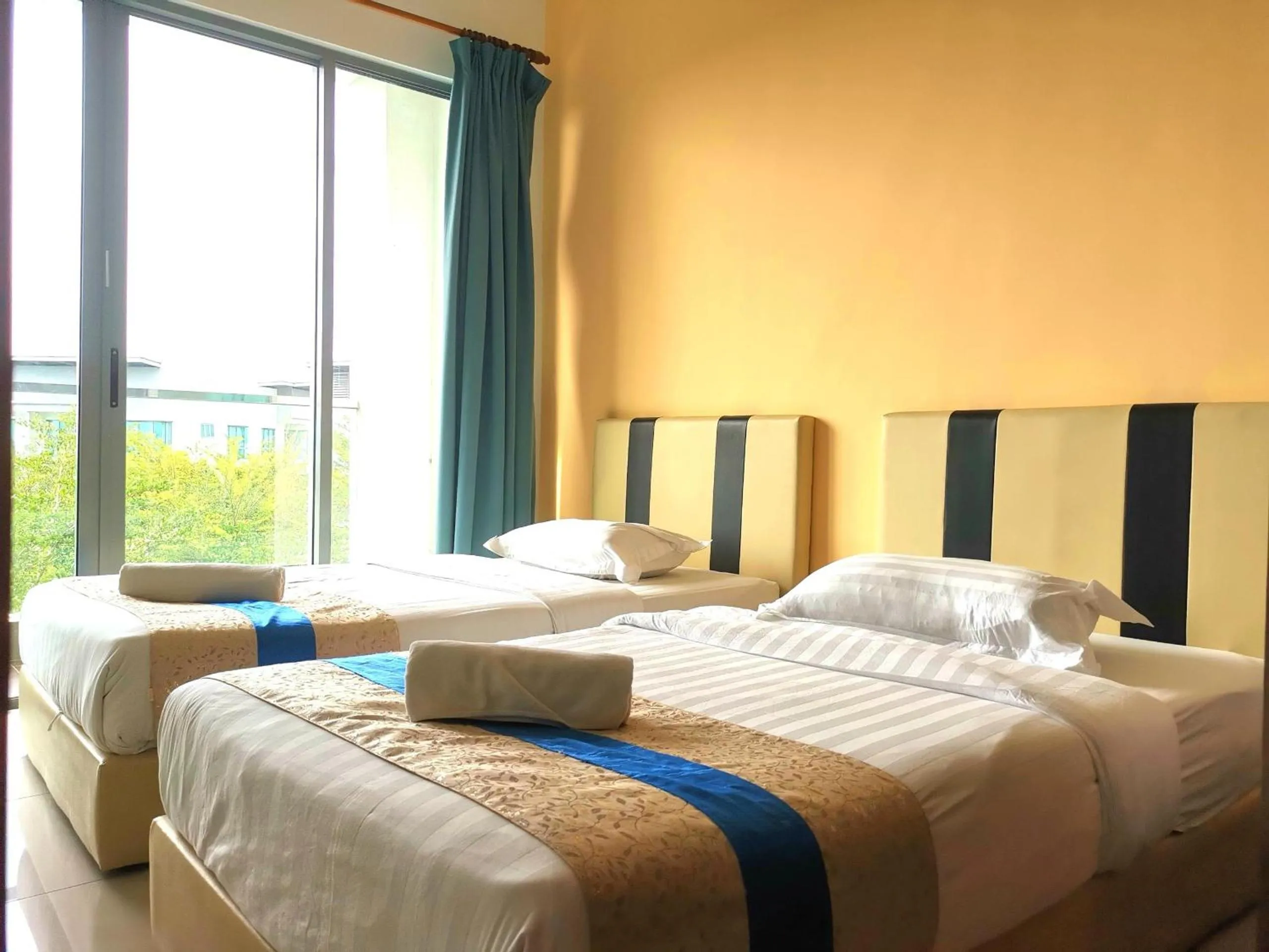 Bed in Sunset Seaview Vacation Condos @ IMAGO Shopping Mall