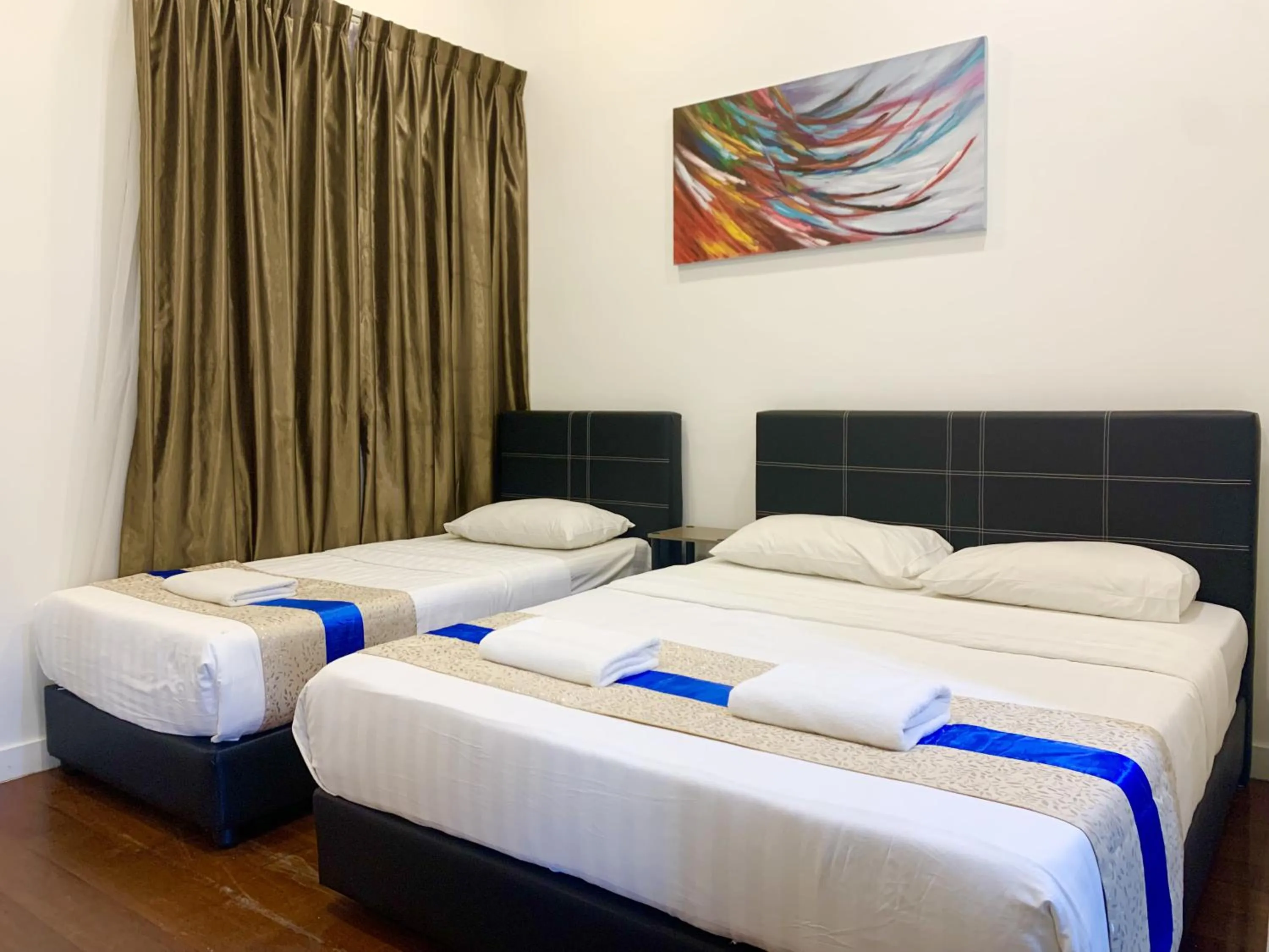 Bed in Sunset Seaview Vacation Condos @ IMAGO Shopping Mall