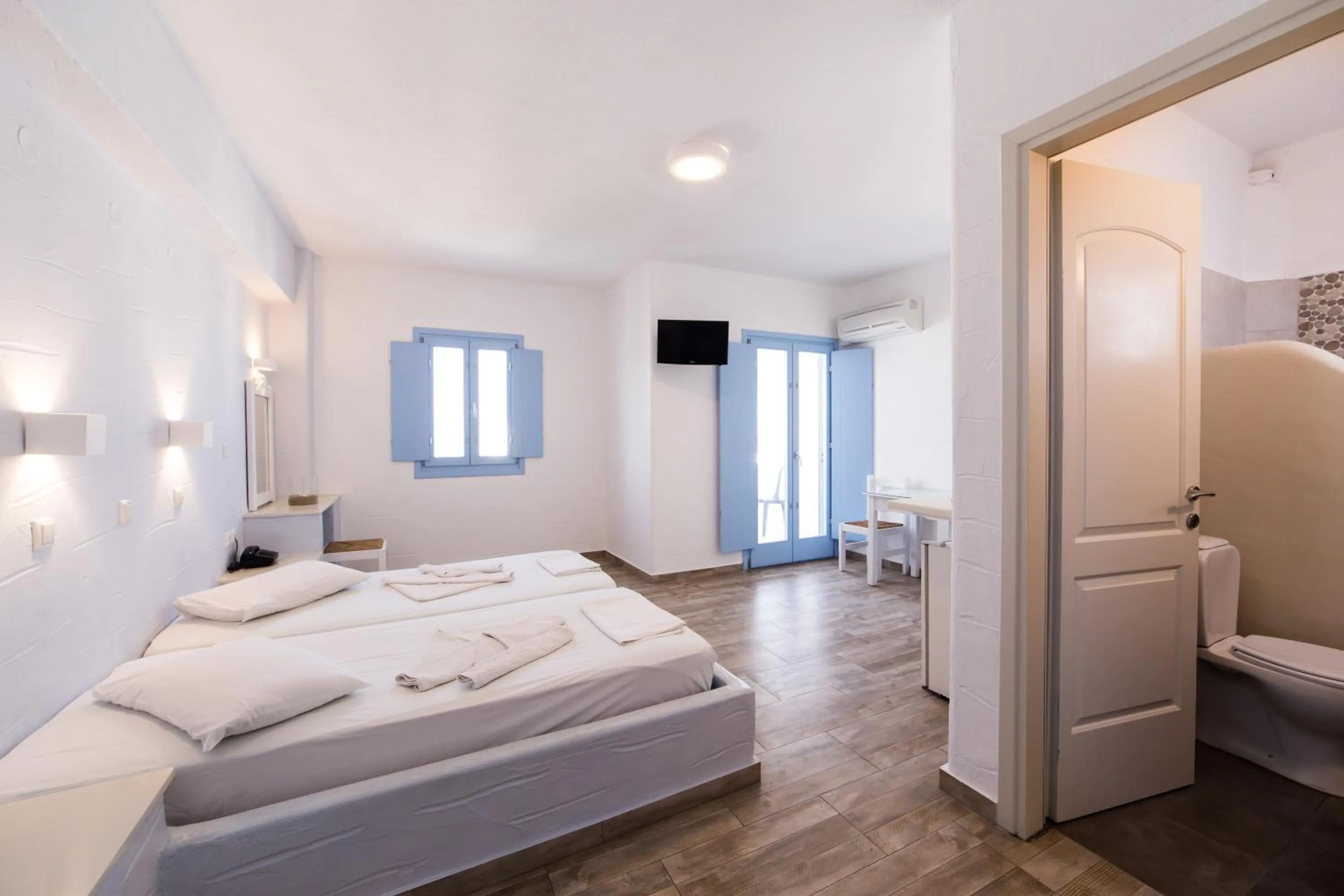 Bed in Stratos Apartments & Studios