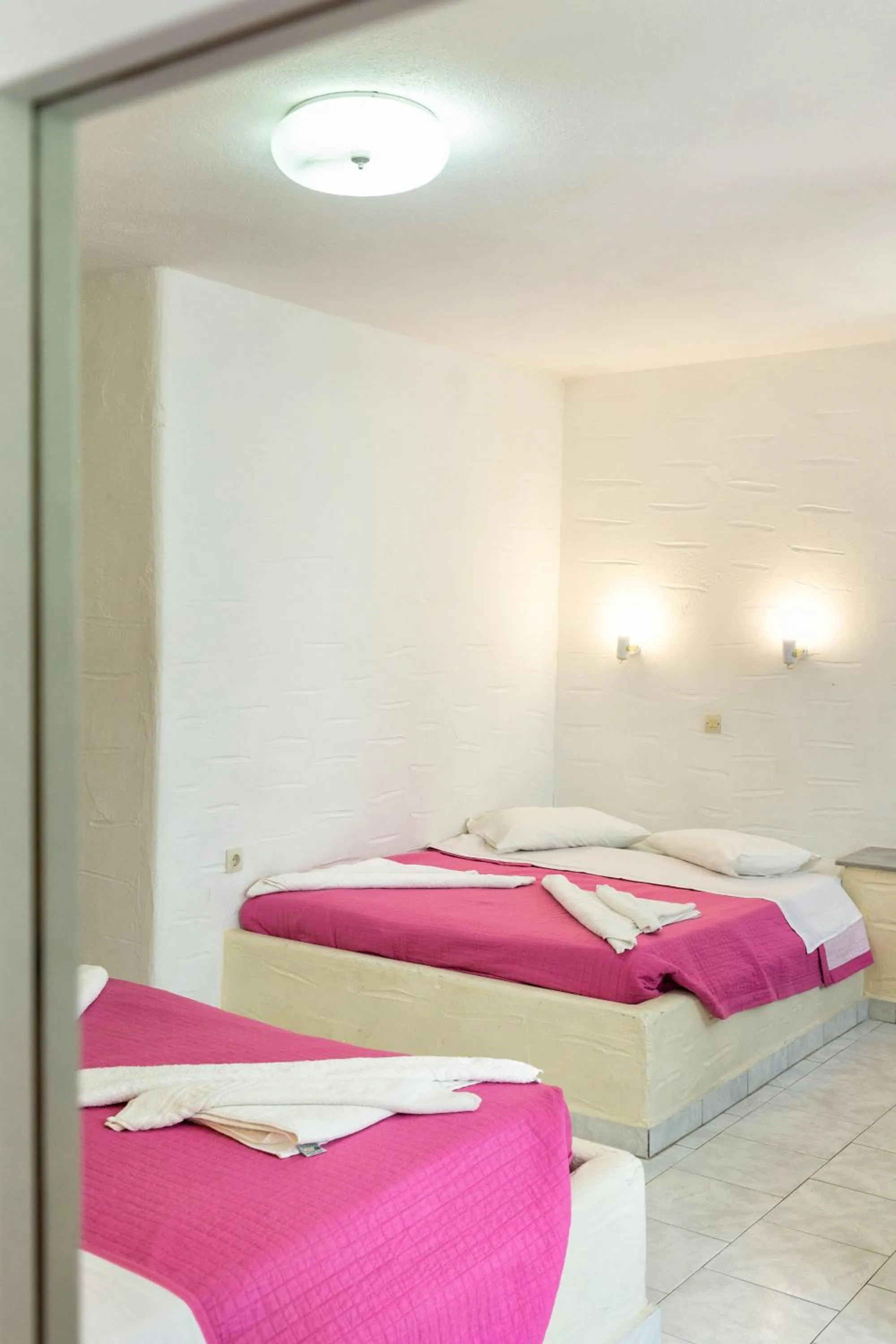 Bed in Stratos Apartments & Studios