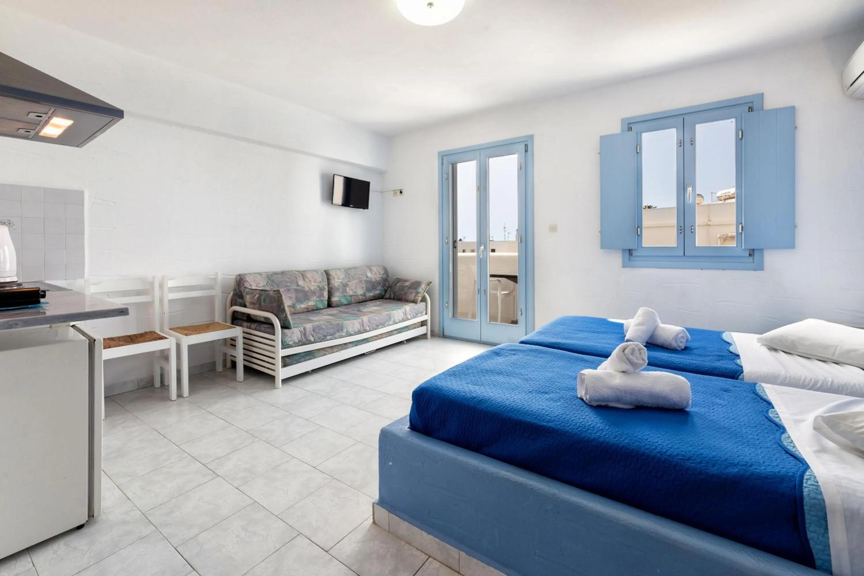 Bed in Stratos Apartments & Studios